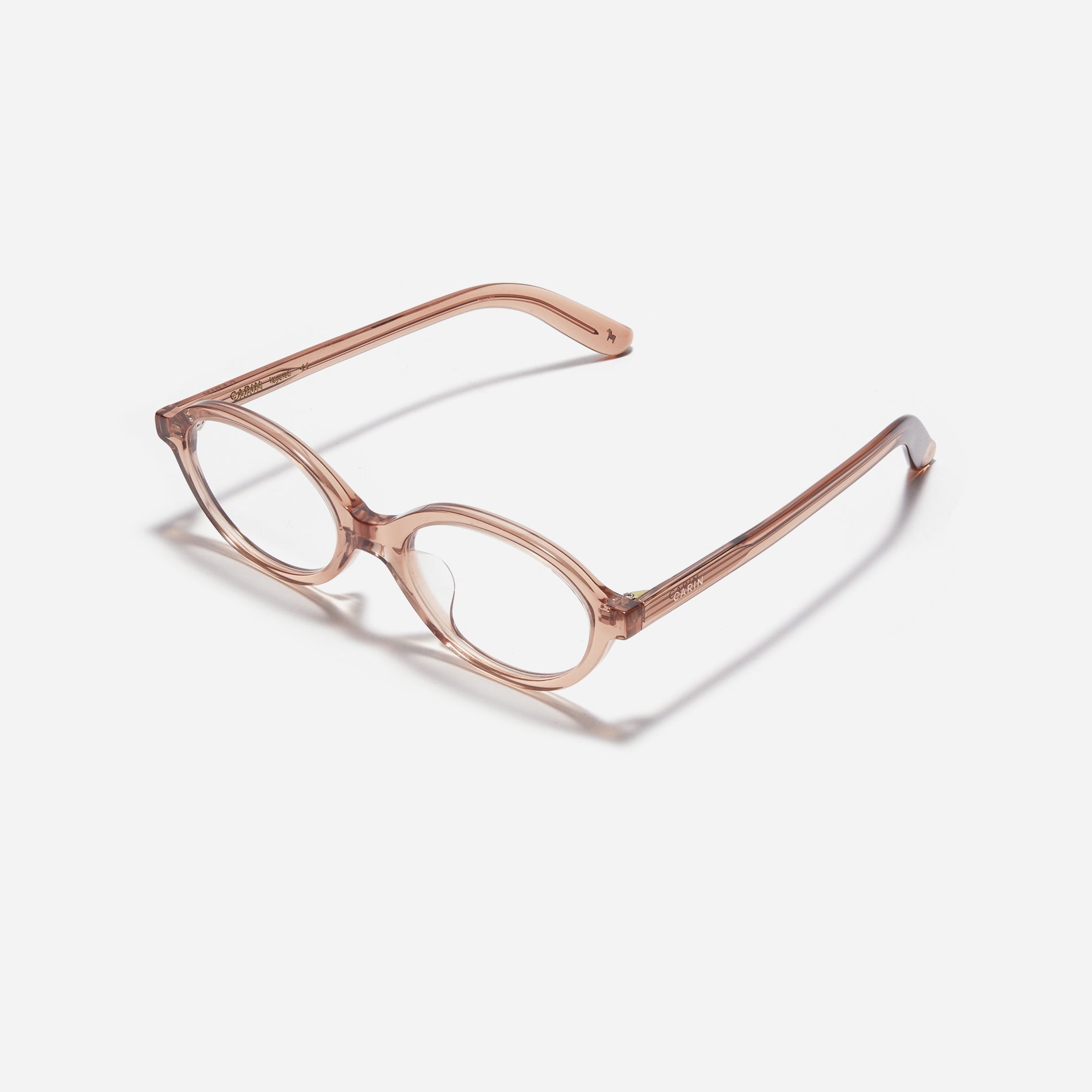 Compact, oval-shaped horn-rimmed eyeglasses featuring a narrow rim and bold frame. Their design captures a modern reinterpretation of 90s retro vibes, providing a trendy and stylish look.