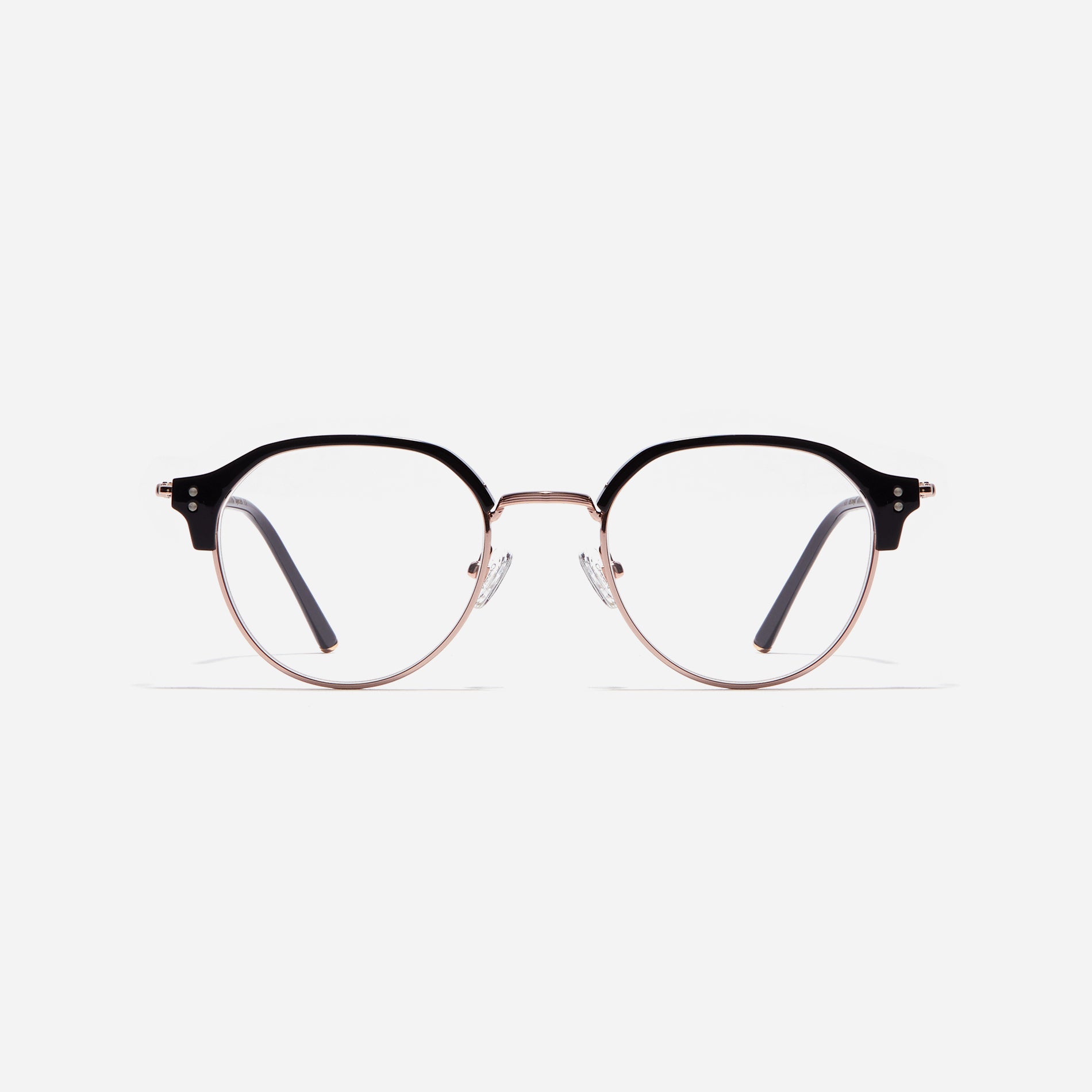 Polygonal-shaped gold-rimmed eyeglasses. The frame, constructed from bioplastic and titanium, seamlessly merges exceptional durability with an ultra-lightweight build, while stylish nose bridge lining details enhance the overall design. The B-titanium temples deliver a lightweight and comfortable fit, guaranteeing prolonged wear without any discomfort.