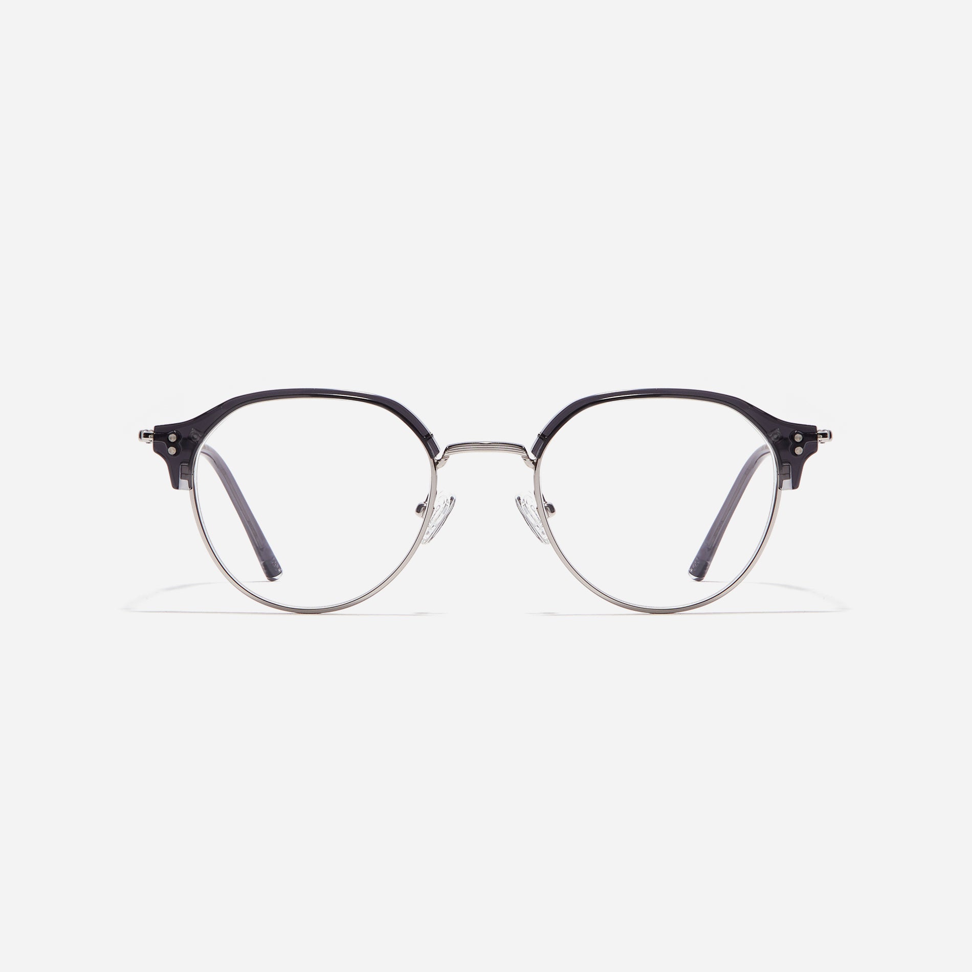 Polygonal-shaped gold-rimmed eyeglasses. The frame, constructed from bioplastic and titanium, seamlessly merges exceptional durability with an ultra-lightweight build, while stylish nose bridge lining details enhance the overall design. The B-titanium temples deliver a lightweight and comfortable fit, guaranteeing prolonged wear without any discomfort.