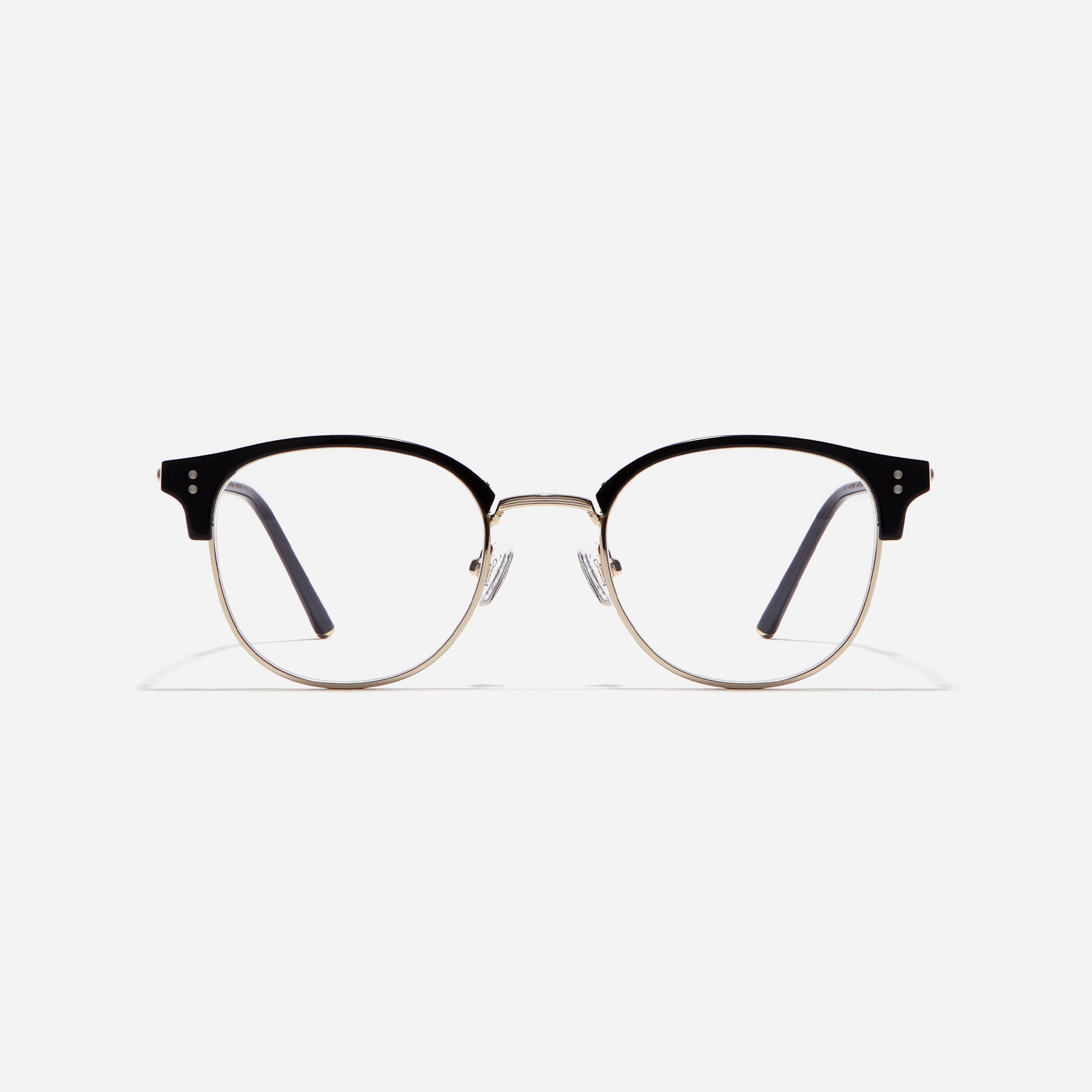 Square-shaped gold-rimmed eyeglasses. The frame, constructed from bioplastic and titanium, seamlessly merges exceptional durability with an ultra-lightweight build, while stylish nose bridge lining details enhance the overall design. The B-titanium temples deliver a lightweight and comfortable fit, guaranteeing prolonged wear without any discomfort.