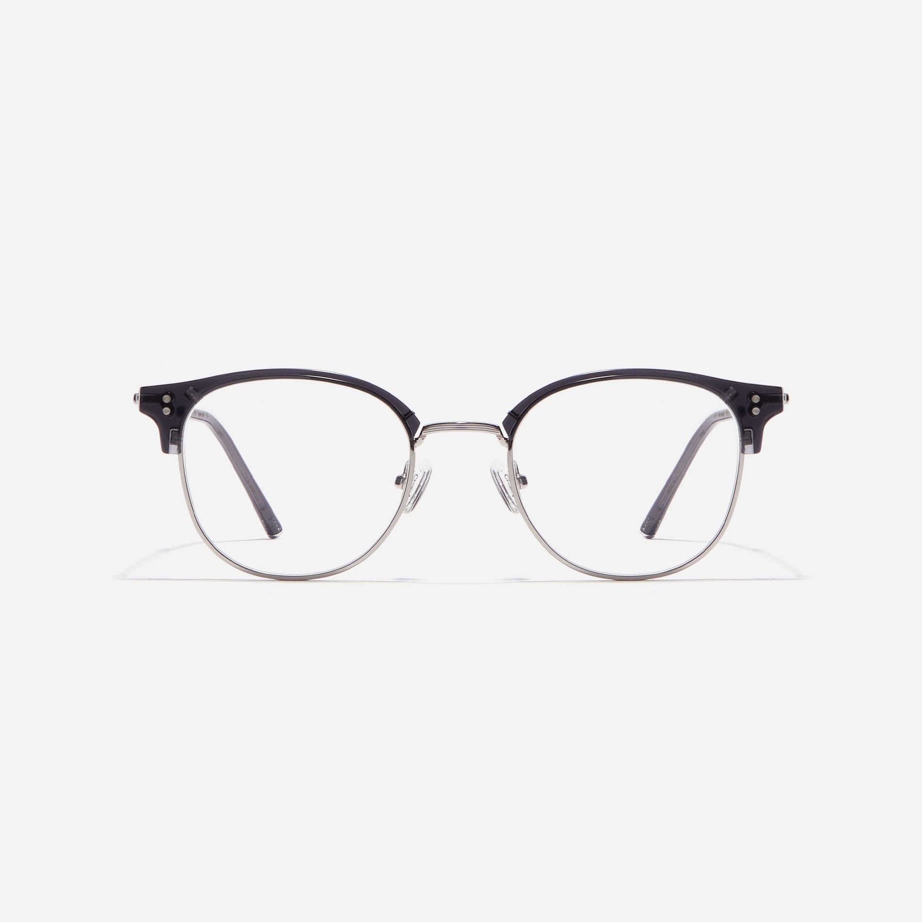 Square-shaped gold-rimmed eyeglasses. The frame, constructed from bioplastic and titanium, seamlessly merges exceptional durability with an ultra-lightweight build, while stylish nose bridge lining details enhance the overall design. The B-titanium temples deliver a lightweight and comfortable fit, guaranteeing prolonged wear without any discomfort.