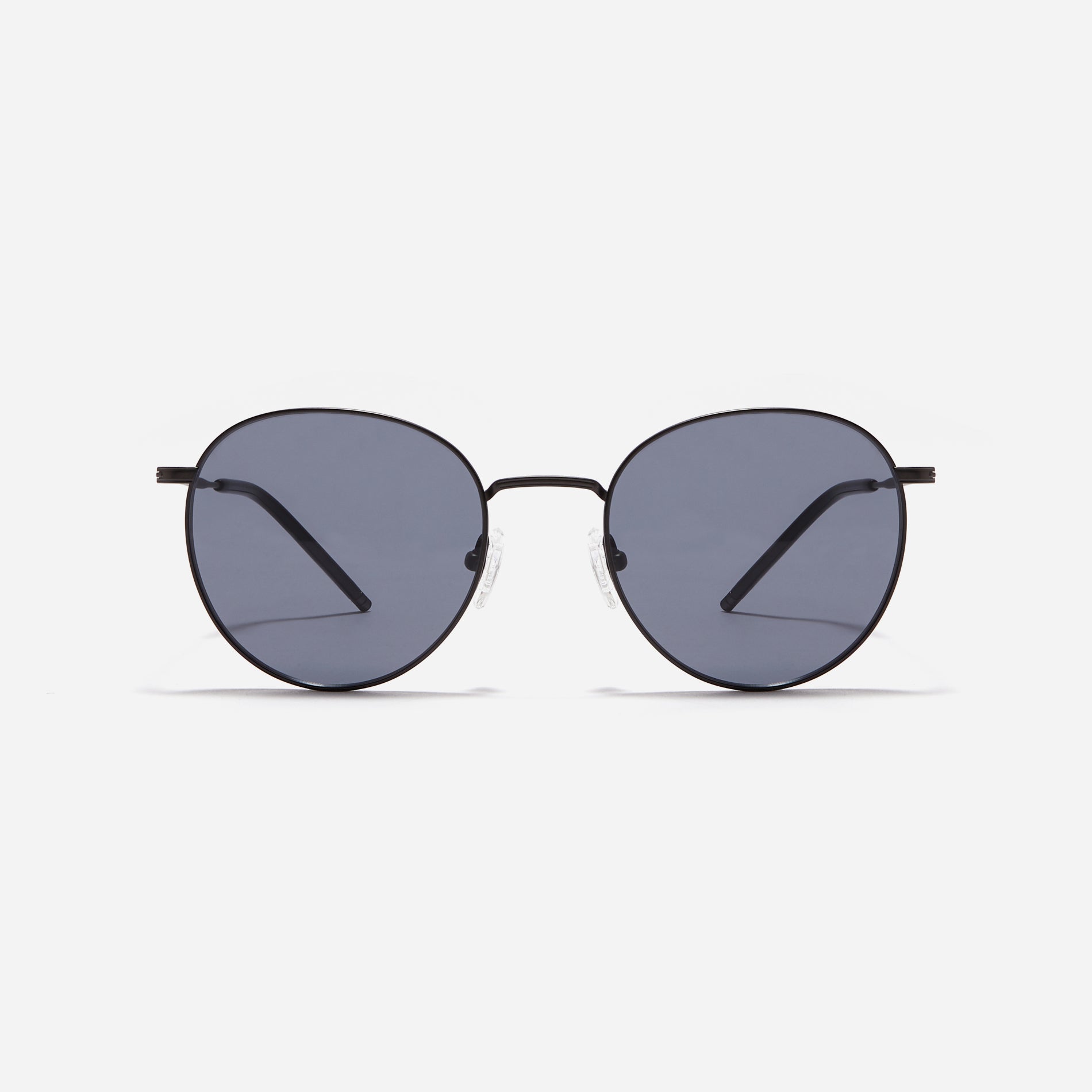 Round-shaped metal sunglasses that offer a soft and natural look with a peach-shaded titanium frame. 