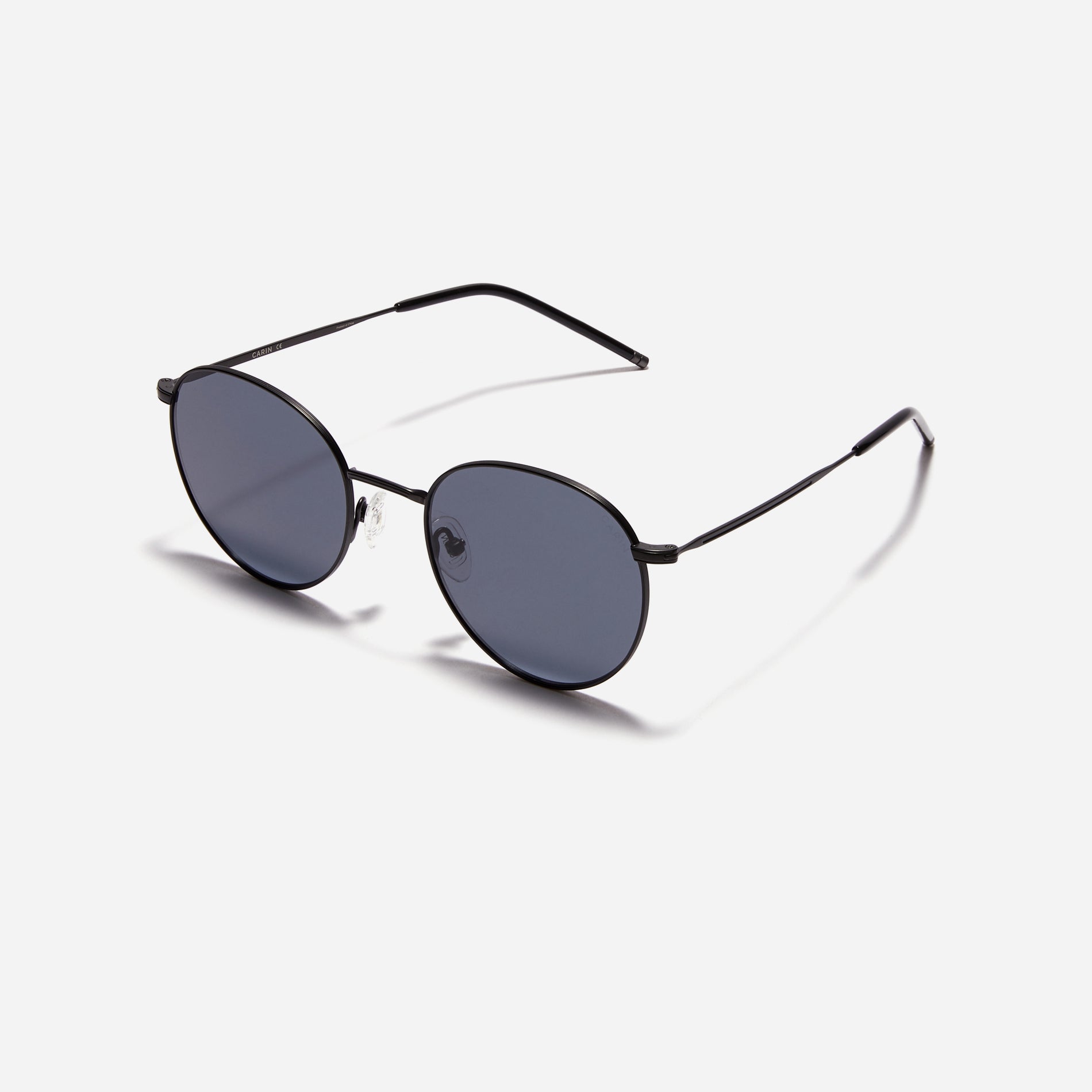 Round-shaped metal sunglasses that offer a soft and natural look with a peach-shaded titanium frame. 