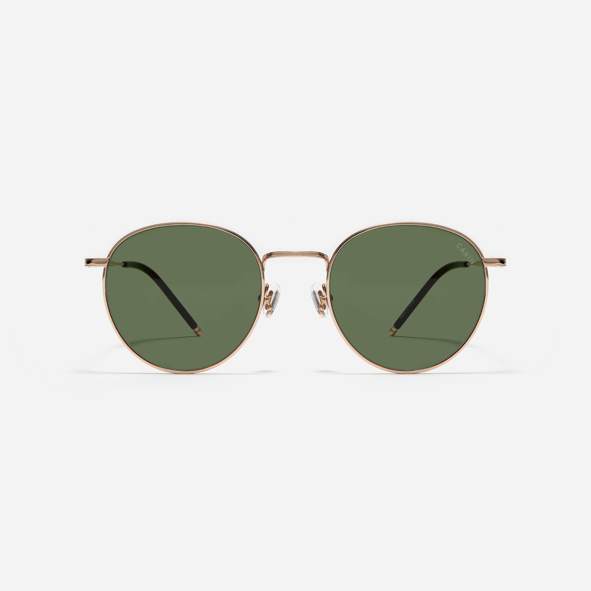 Round-shaped metal sunglasses that offer a soft and natural look with a peach-shaded titanium frame. 