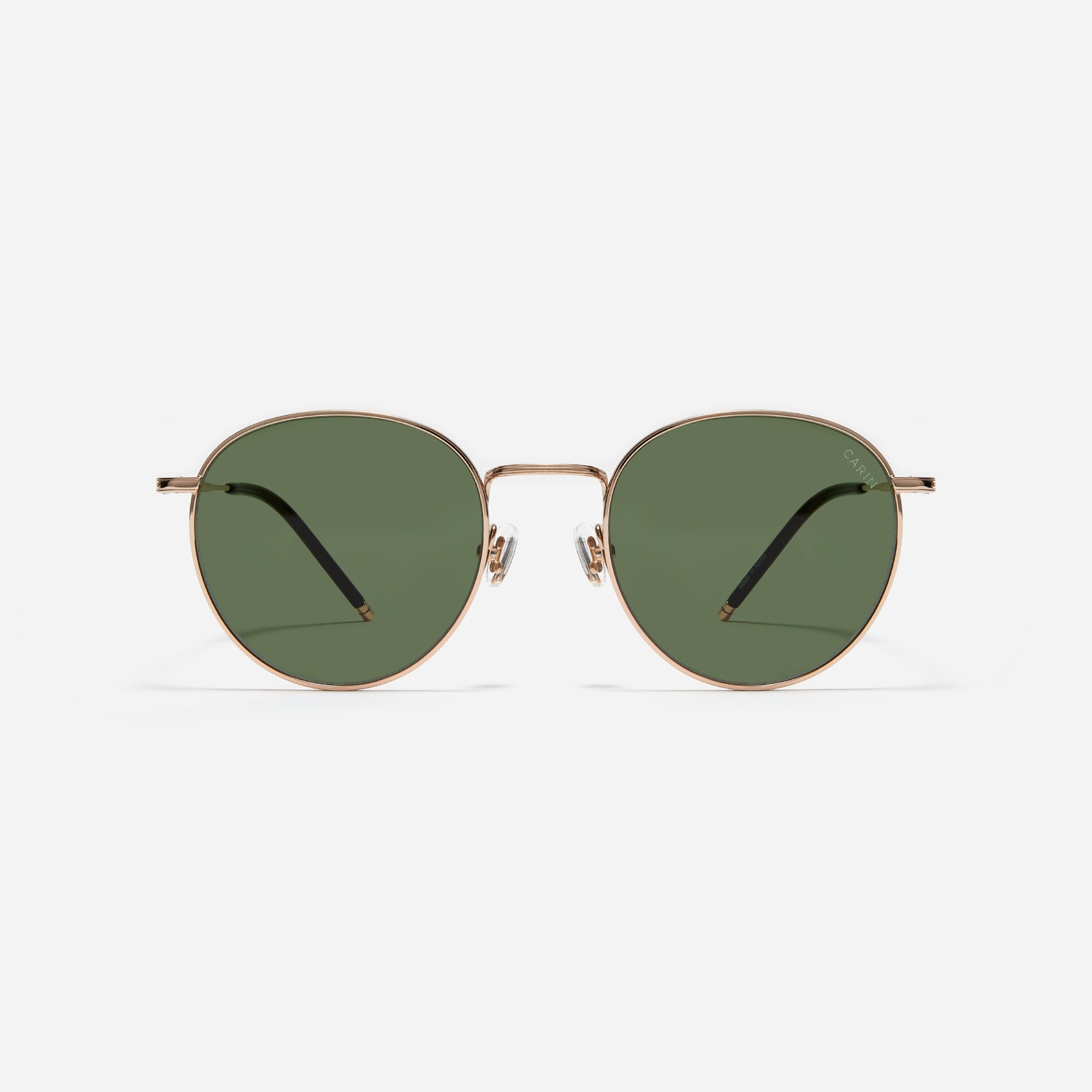 Round-shaped metal sunglasses that offer a soft and natural look with a peach-shaded titanium frame.