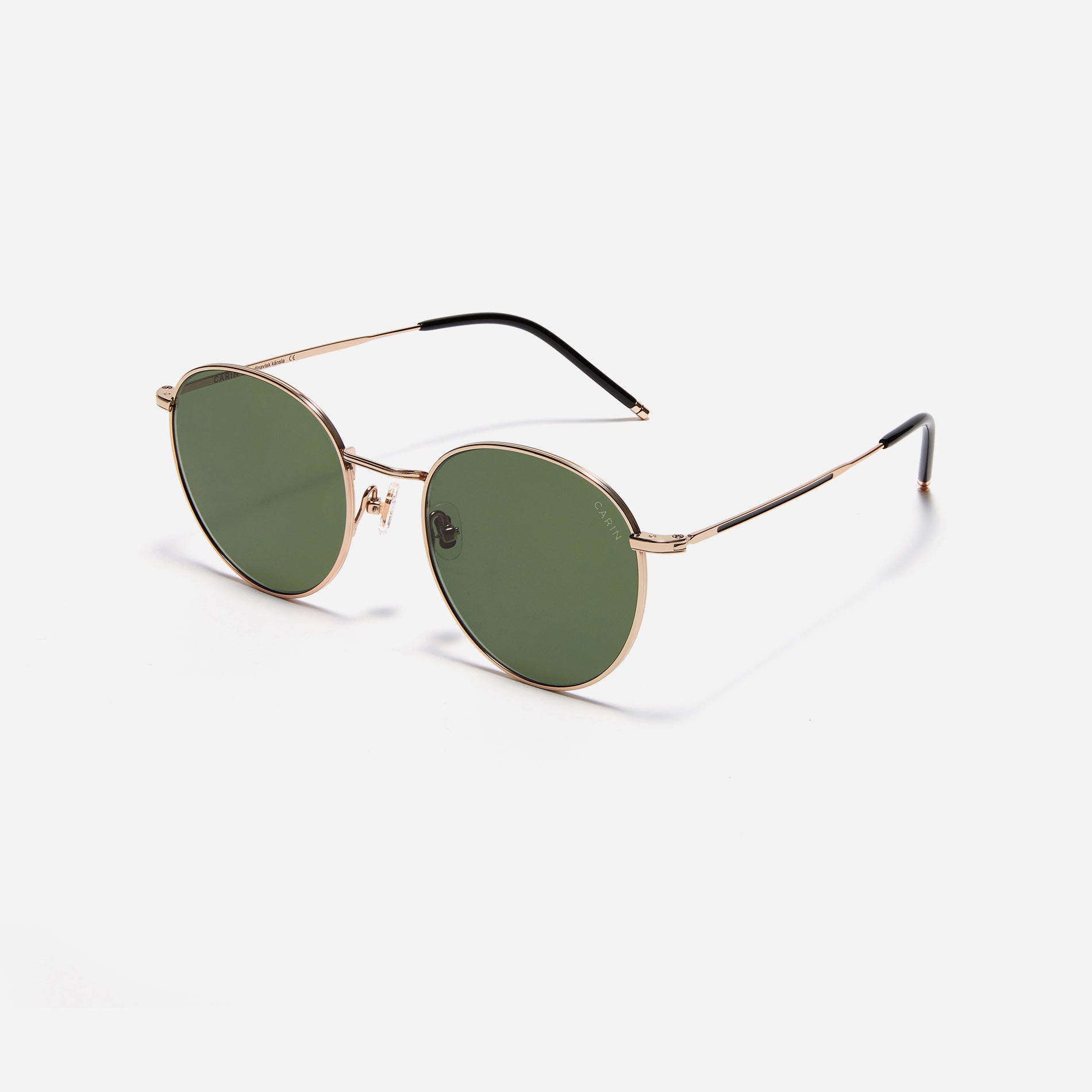 Round-shaped metal sunglasses that offer a soft and natural look with a peach-shaded titanium frame. 