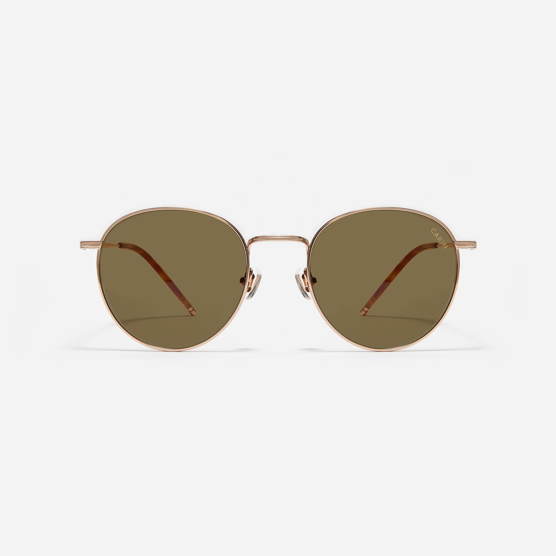 Round-shaped metal sunglasses that offer a soft and natural look with a peach-shaded titanium frame.