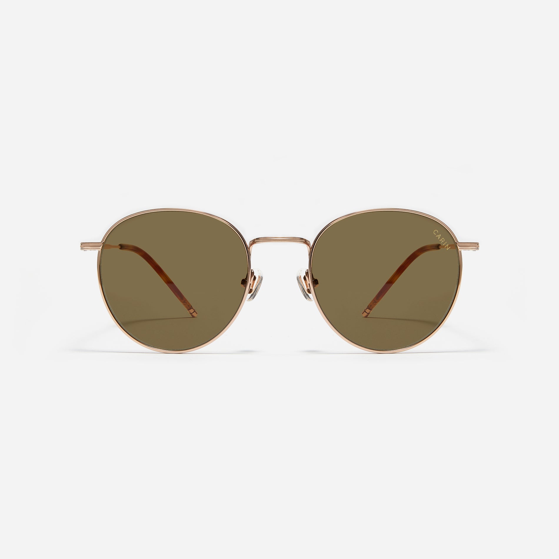 Round-shaped metal sunglasses that offer a soft and natural look with a peach-shaded titanium frame. 