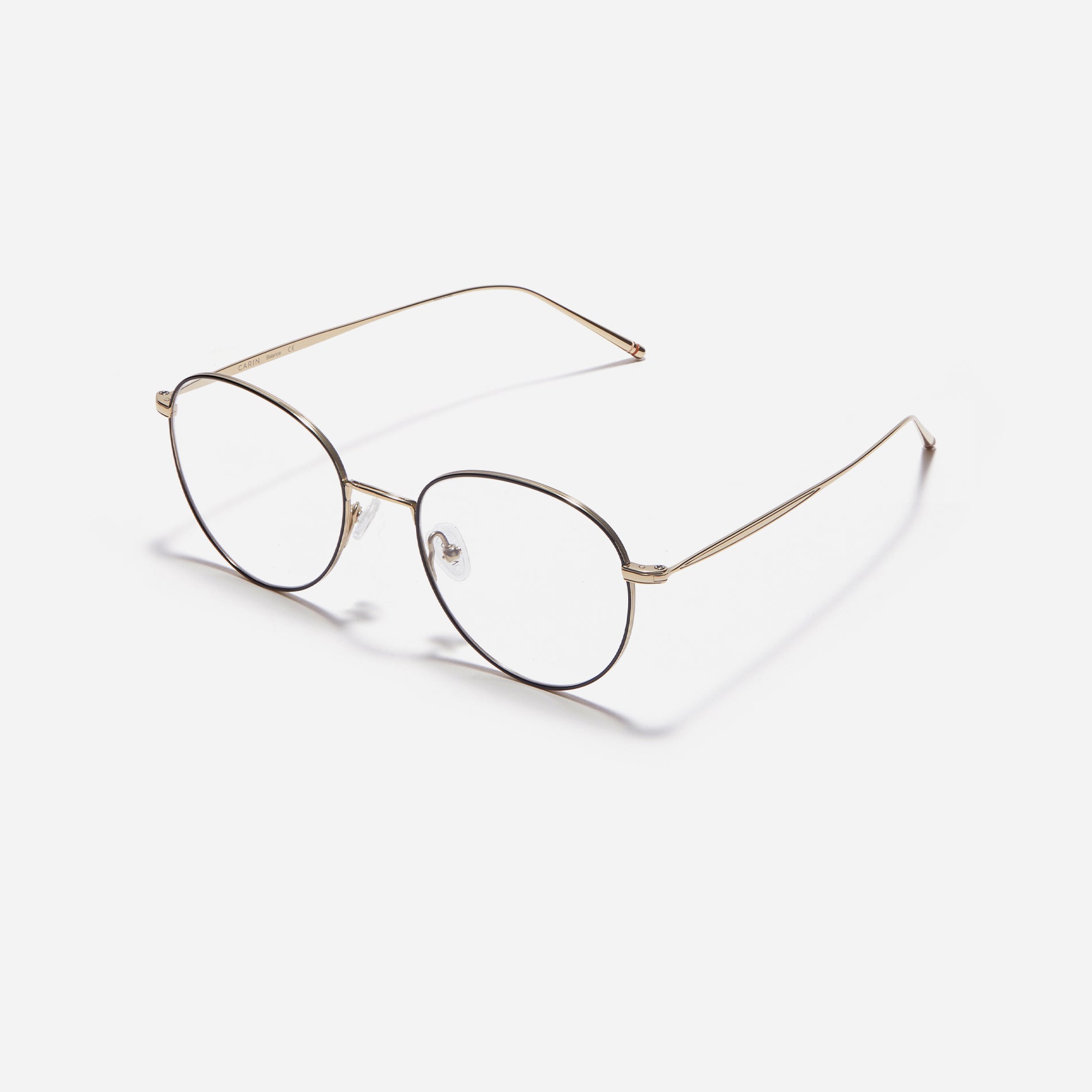 Boston-style round-shaped eyeglasses that naturally enhance one's facial features. Crafted entirely from titanium, they guarantee a lighter and more comfortable fit, while modern design makes them a perfect choice for those seeking a contemporary look.