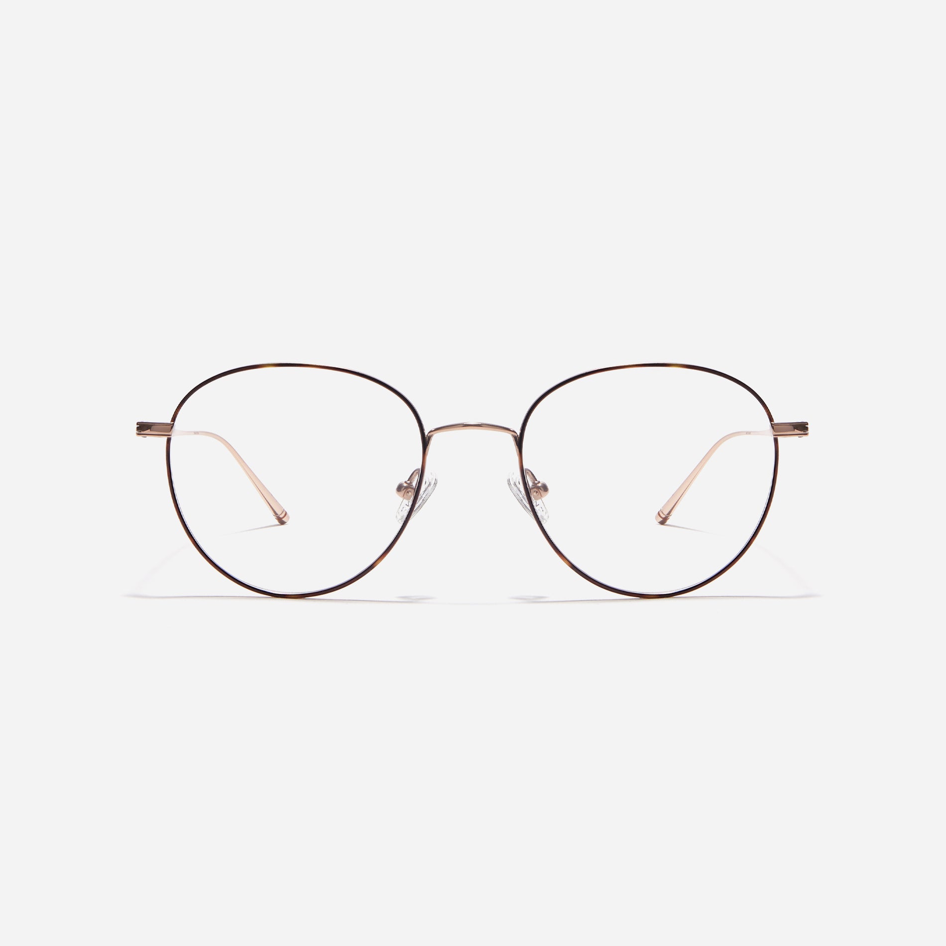 Boston-style round-shaped eyeglasses that naturally enhance one's facial features. Crafted entirely from titanium, they guarantee a lighter and more comfortable fit, while modern design makes them a perfect choice for those seeking a contemporary look.