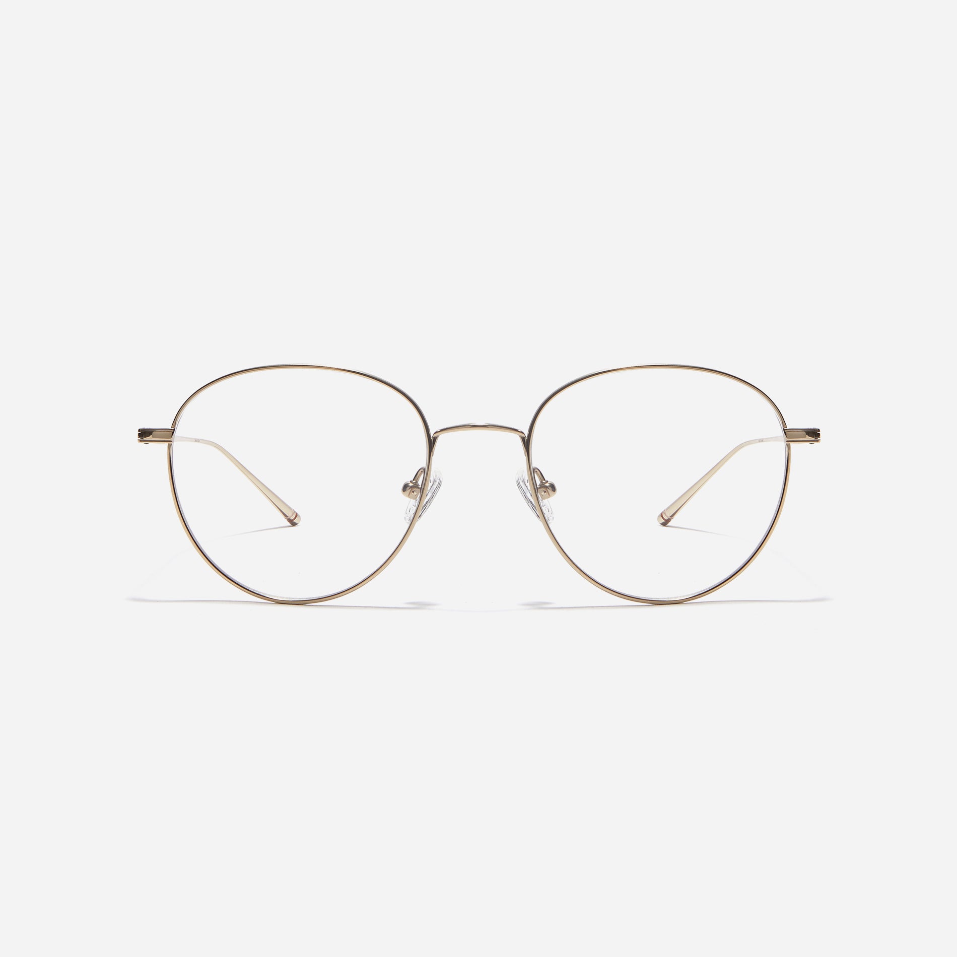 Boston-style round-shaped eyeglasses that naturally enhance one's facial features. Crafted entirely from titanium, they guarantee a lighter and more comfortable fit, while modern design makes them a perfect choice for those seeking a contemporary look.