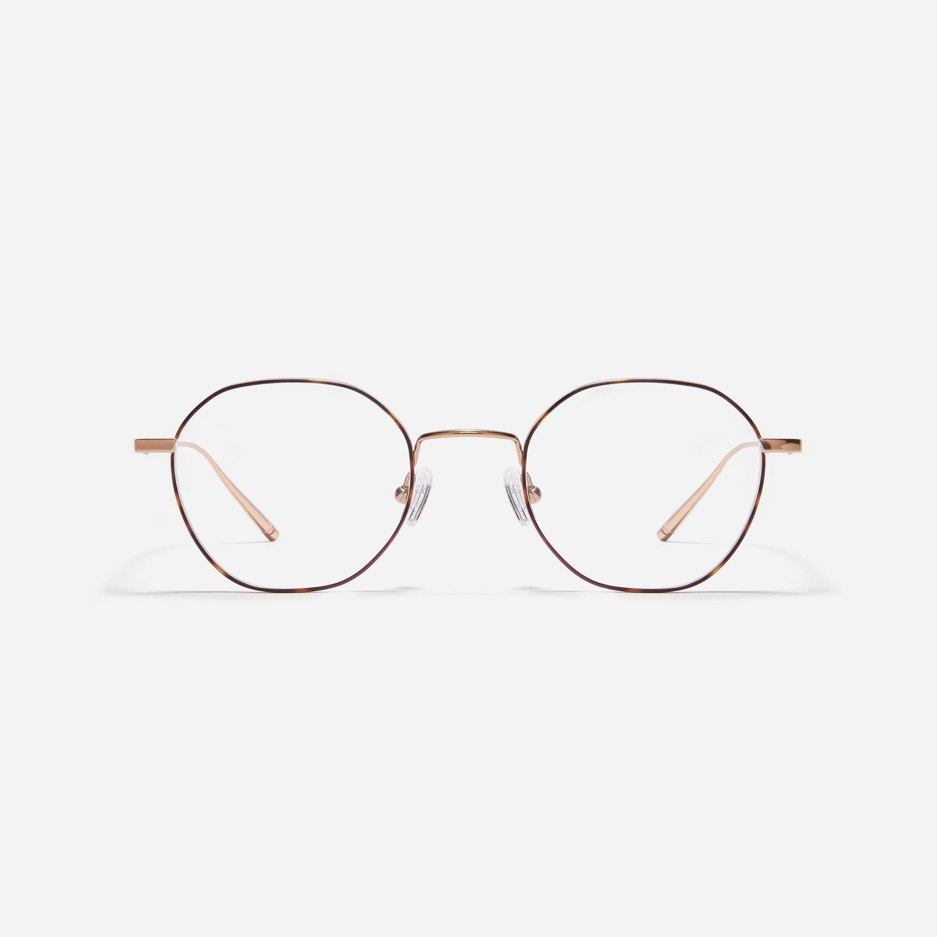 Hexagonal-shaped, full-metal eyeglasses with a dual-rim structure designed to accommodate thicker, high-prescription lenses. Both the frame and temples are made of pure titanium, ensuring a lightweight and comfortable fit.