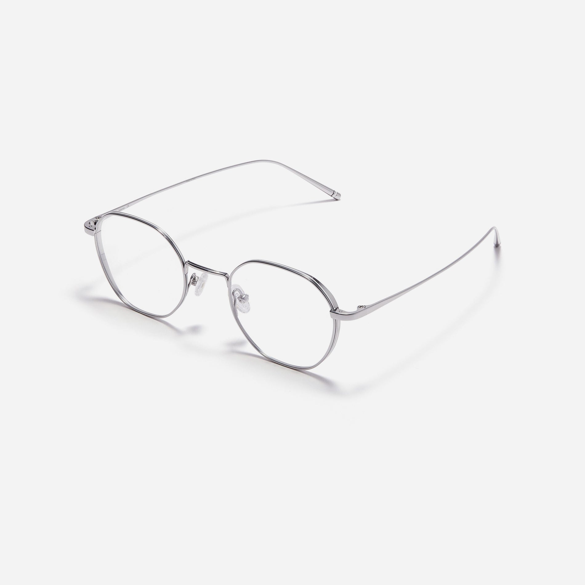 Hexagonal-shaped, full-metal eyeglasses with a dual-rim structure designed to accommodate thicker, high-prescription lenses. Both the frame and temples are made of pure titanium, ensuring a lightweight and comfortable fit.