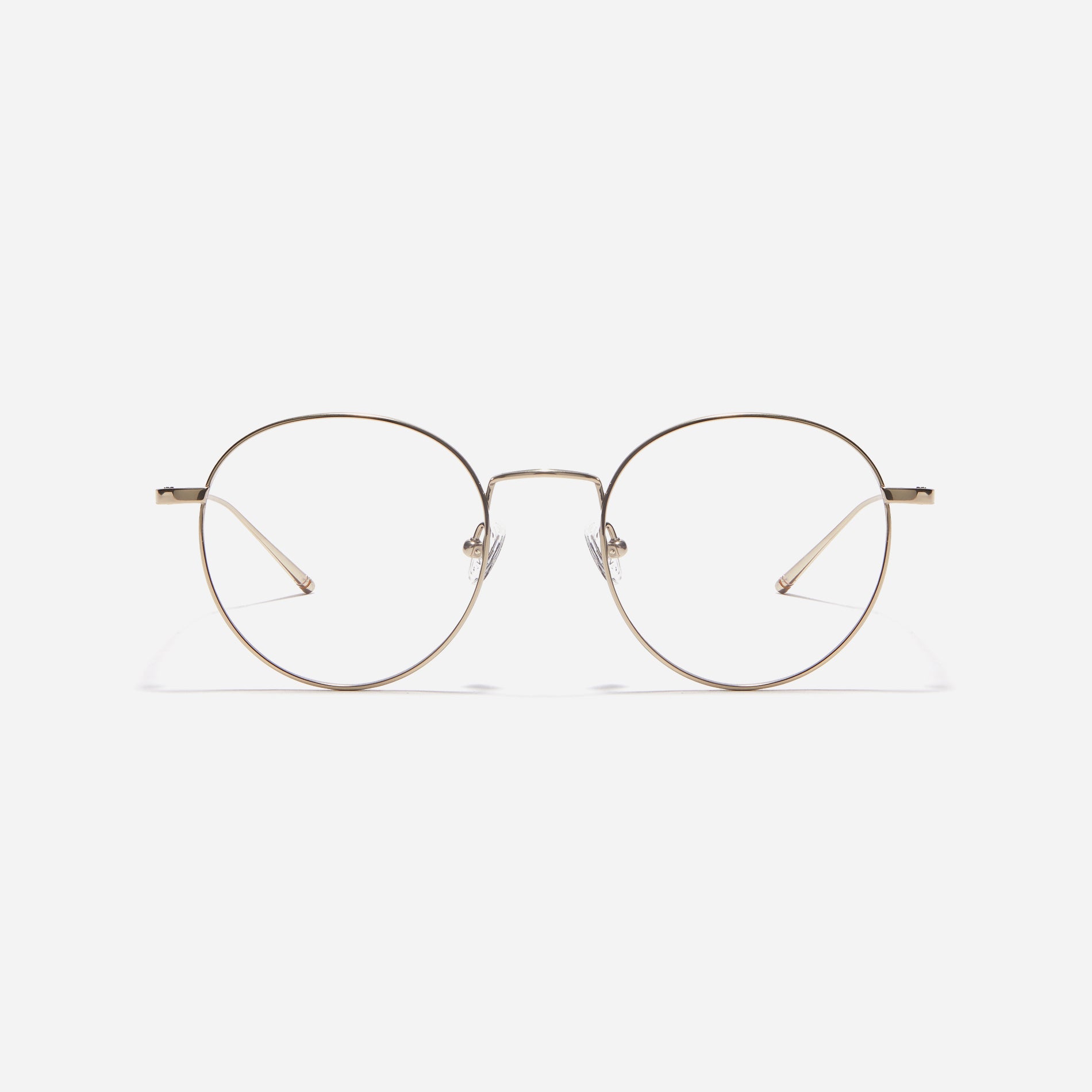 Round-shaped eyeglasses that naturally complement all face shapes. Crafted entirely from titanium, the frame provides exceptional durability and featherweight comfort, while its design adds a touch of casual charm to one's daily style.