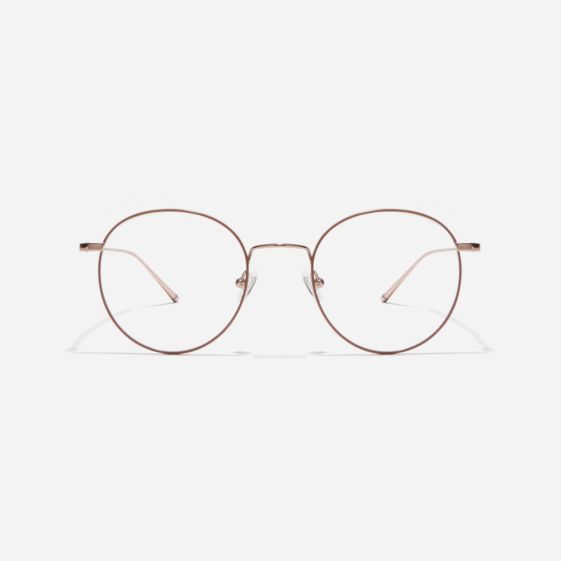 Round-shaped eyeglasses that naturally complement all face shapes. Crafted entirely from titanium, the frame provides exceptional durability and featherweight comfort, while its design adds a touch of casual charm to one's daily style.