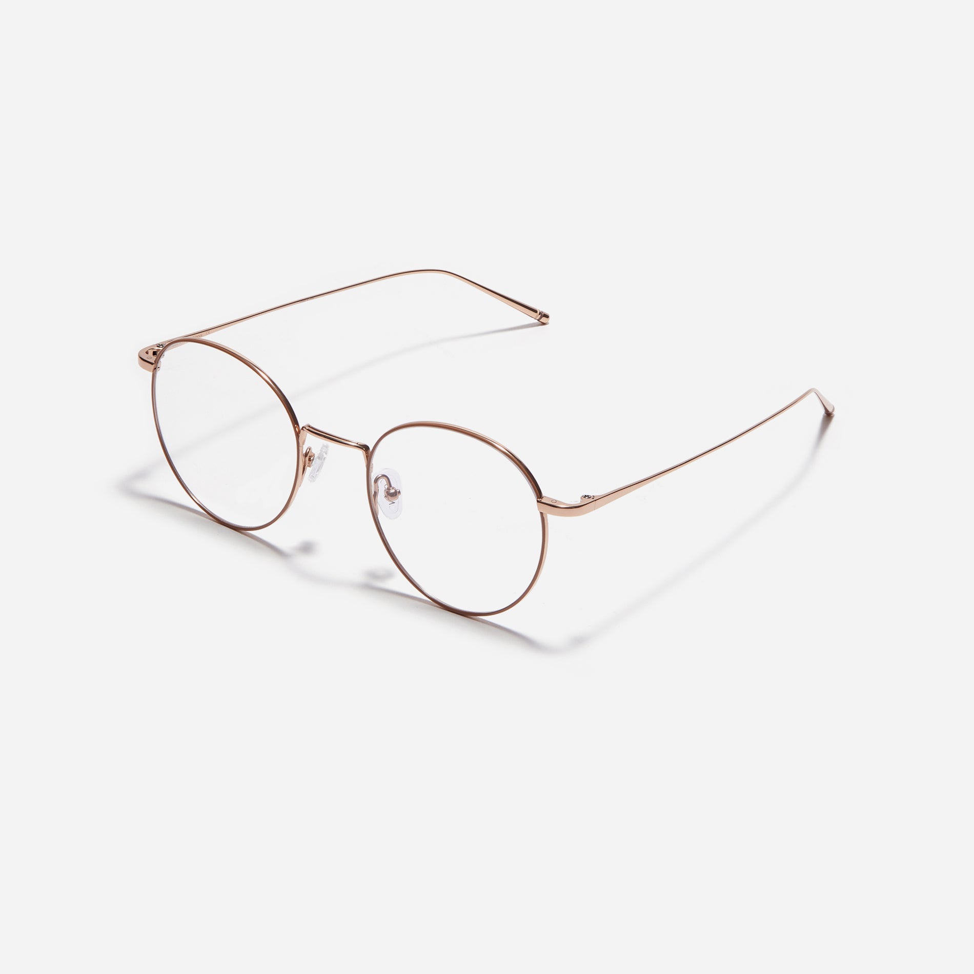 Round-shaped eyeglasses that naturally complement all face shapes. Crafted entirely from titanium, the frame provides exceptional durability and featherweight comfort, while its design adds a touch of casual charm to one's daily style.