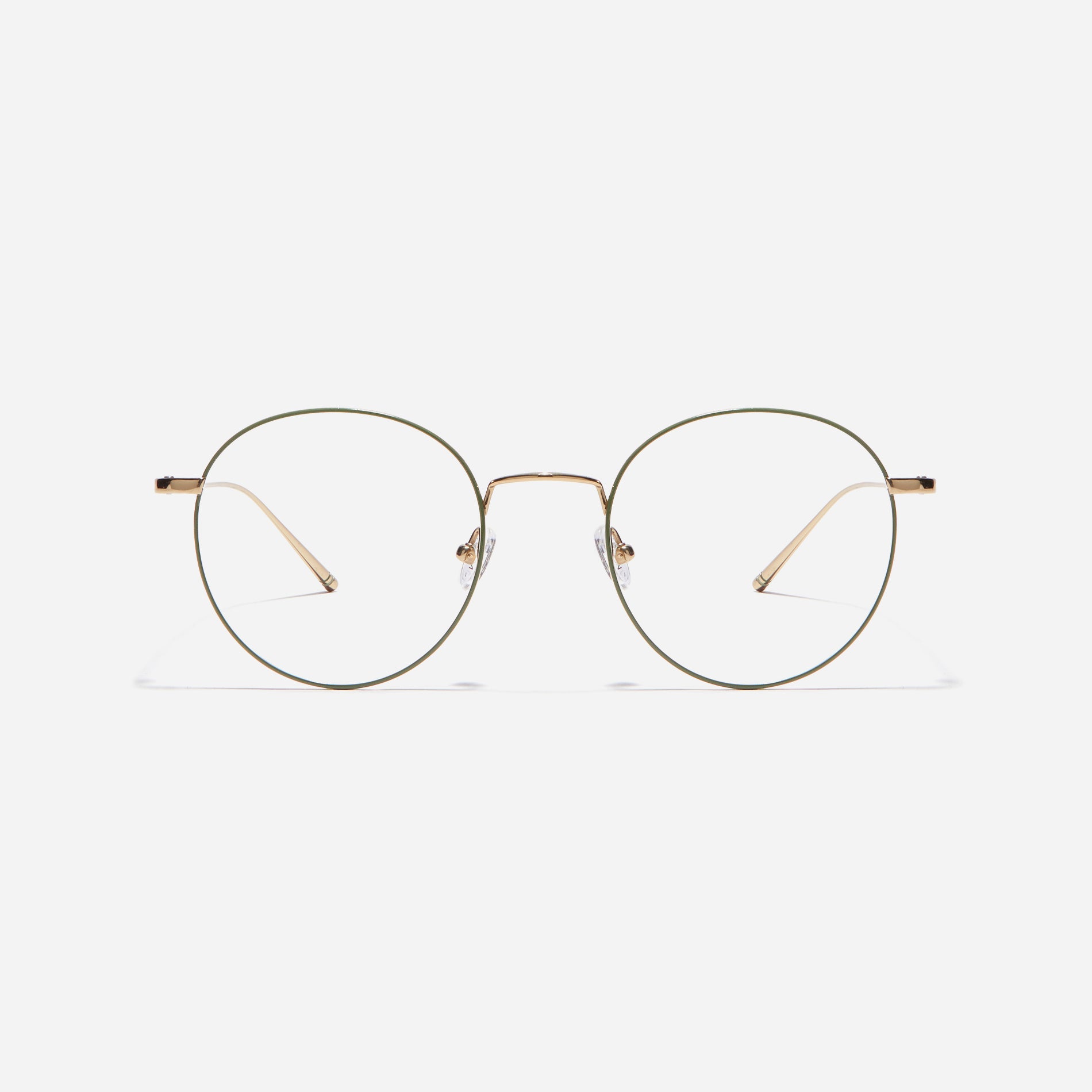 Round-shaped eyeglasses that naturally complement all face shapes. Crafted entirely from titanium, the frame provides exceptional durability and featherweight comfort, while its design adds a touch of casual charm to one's daily style.