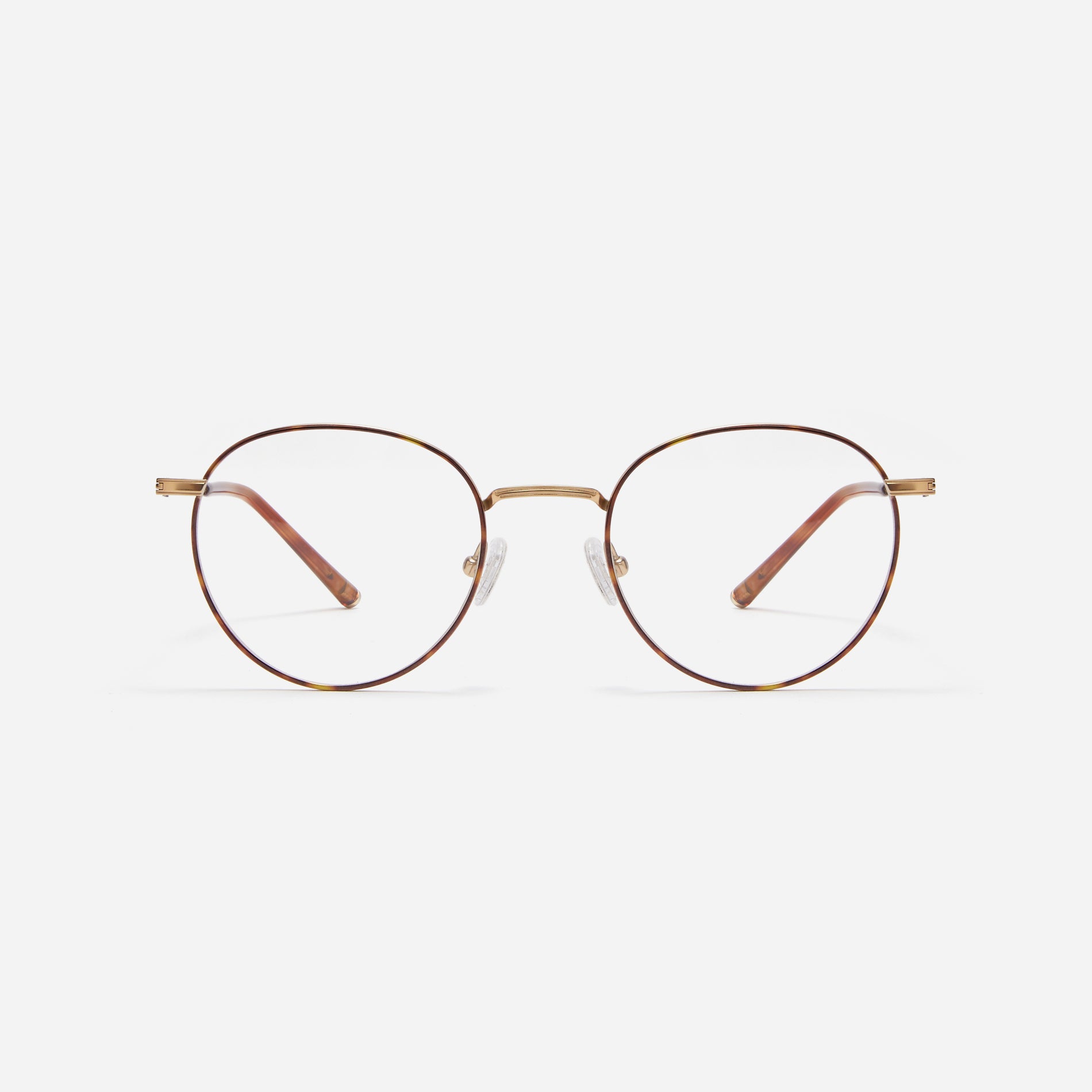 Round-shaped blue light blocking eyeglasses. Crafted entirely from pure titanium, they offer a lightweight and comfortable wearing experience. The three-dimensional lining details on the frame and temples, combined with epoxy and matte plating, enhance its classic ambiance.
