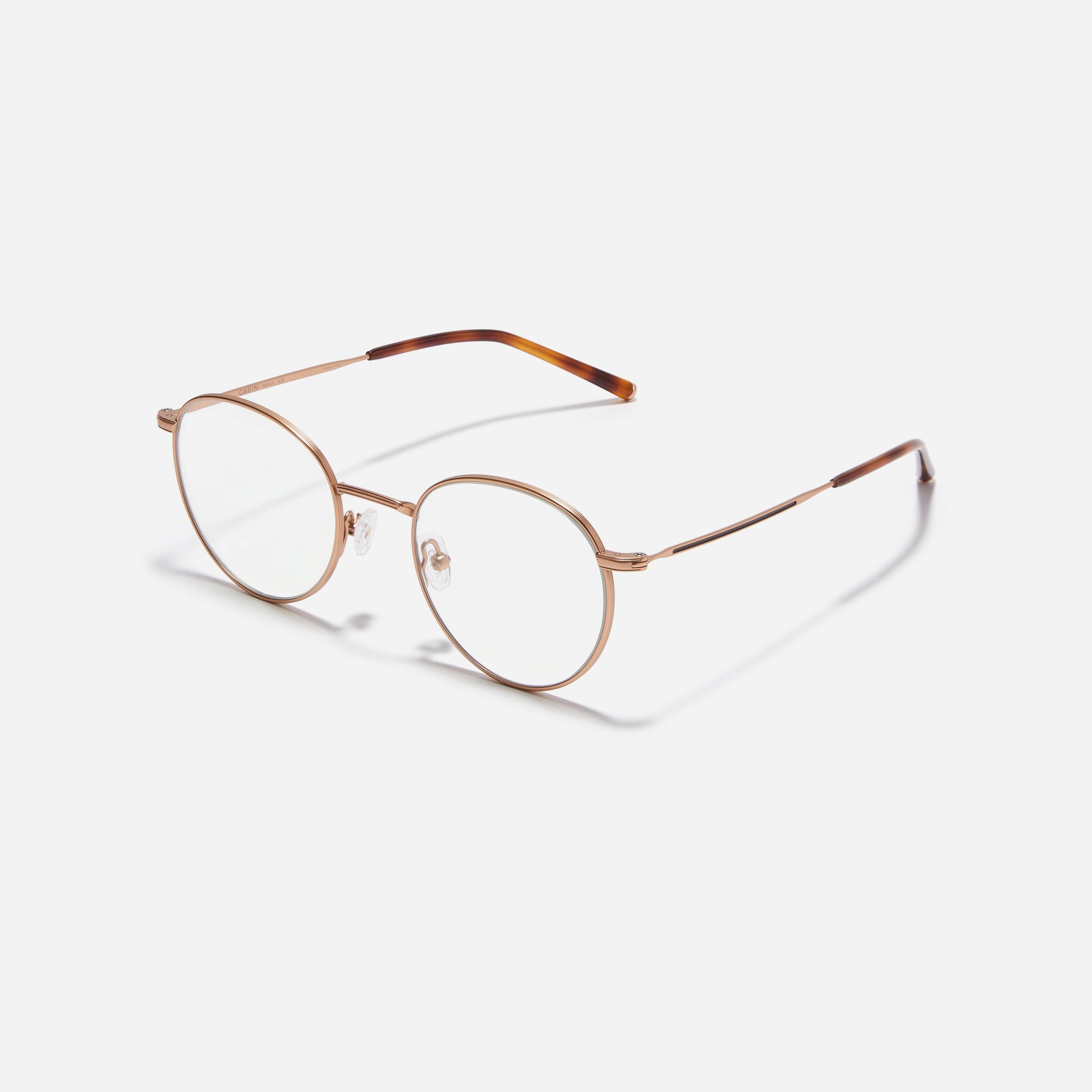 Round-shaped blue light blocking eyeglasses. Crafted entirely from pure titanium, they offer a lightweight and comfortable wearing experience. The three-dimensional lining details on the frame and temples, combined with epoxy and matte plating, enhance its classic ambiance.