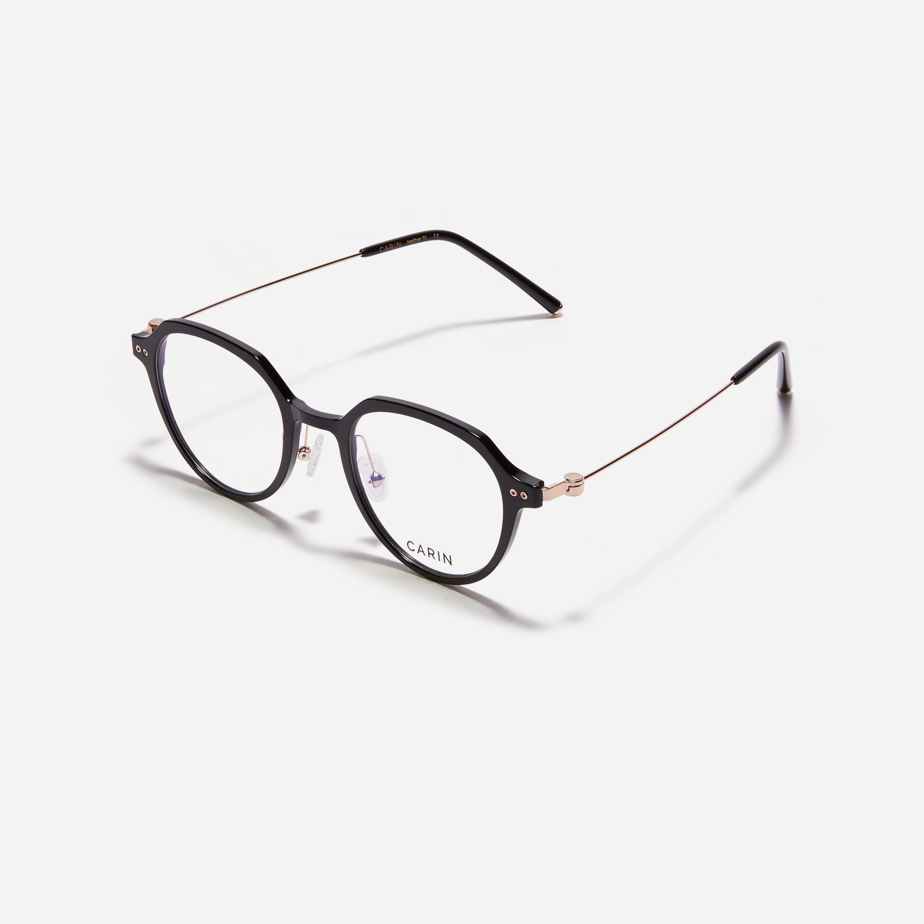 Polygonal-shaped eyeglasses crafted with a blend of G850 bio-plastic and stainless steel, ensuring resilience against breakage. Incorporated with CARIN's patented anti-loosening hinge technology, these eyeglasses ensure a consistently comfortable fit.