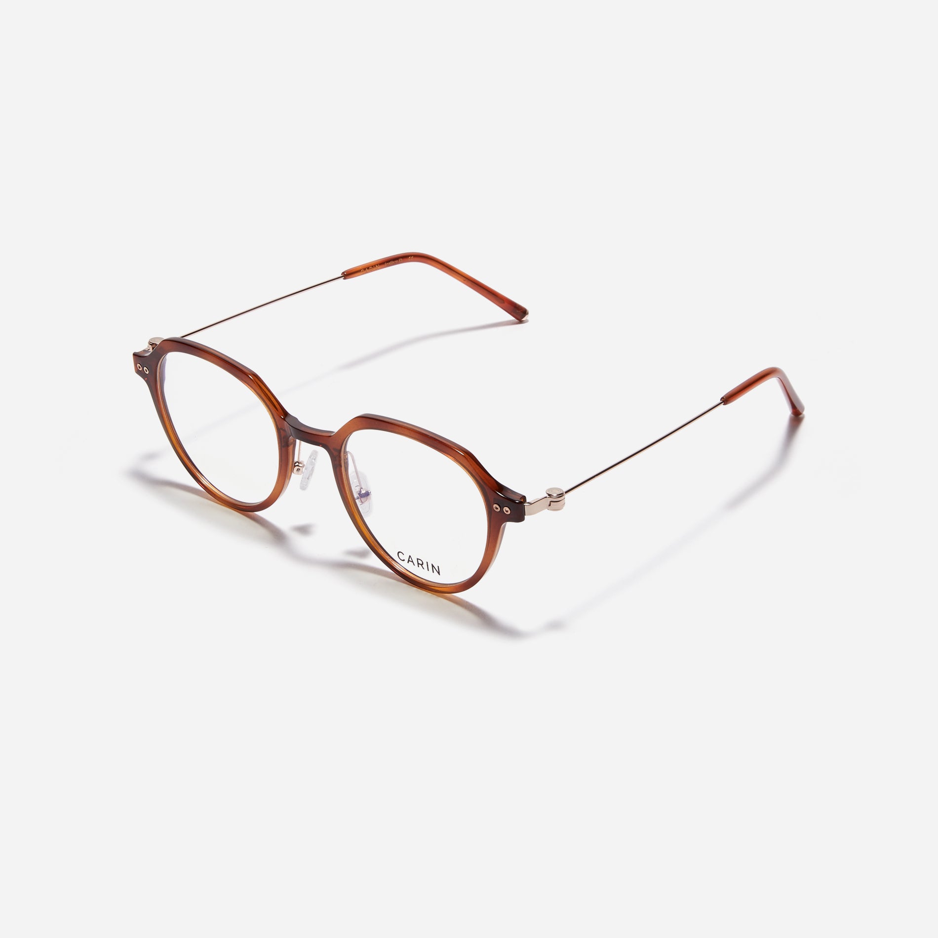 Polygonal-shaped eyeglasses crafted with a blend of G850 bio-plastic and stainless steel, ensuring resilience against breakage. Incorporated with CARIN's patented anti-loosening hinge technology, these eyeglasses ensure a consistently comfortable fit.