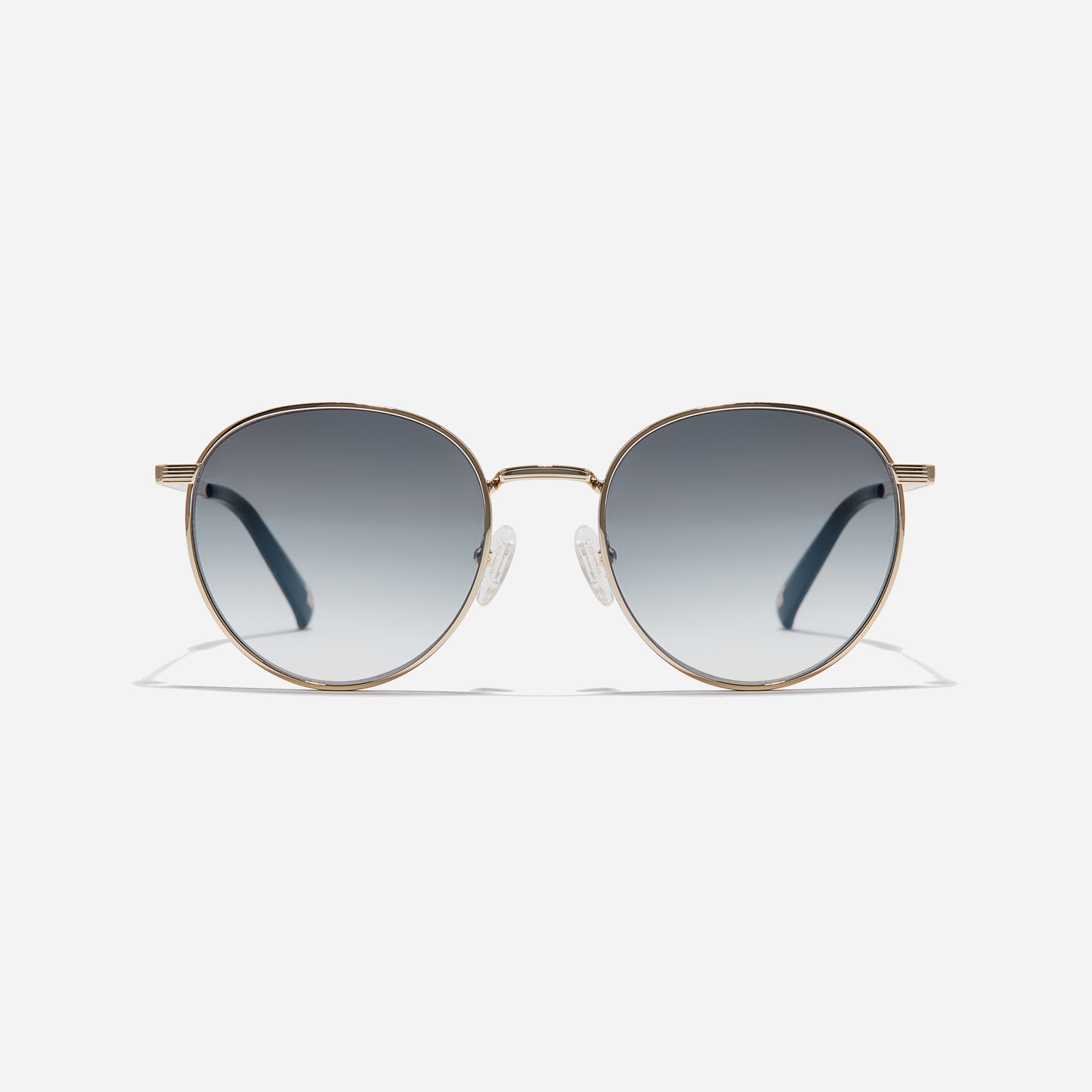 Boeing-style sunglasses featuring chic temple details and half-mirrored lens coating that reduces glare and provides 100% UV protection.