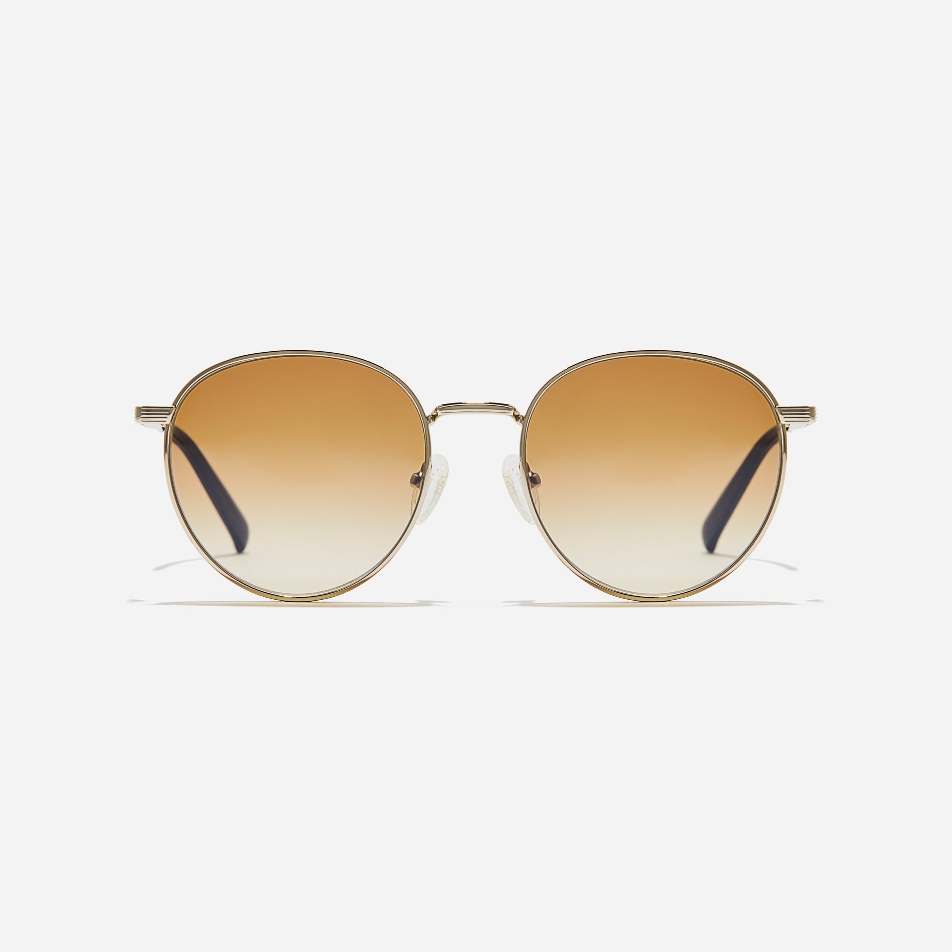 Boeing-style sunglasses featuring chic temple details and half-mirrored lens coating that reduces glare and provides 100% UV protection.