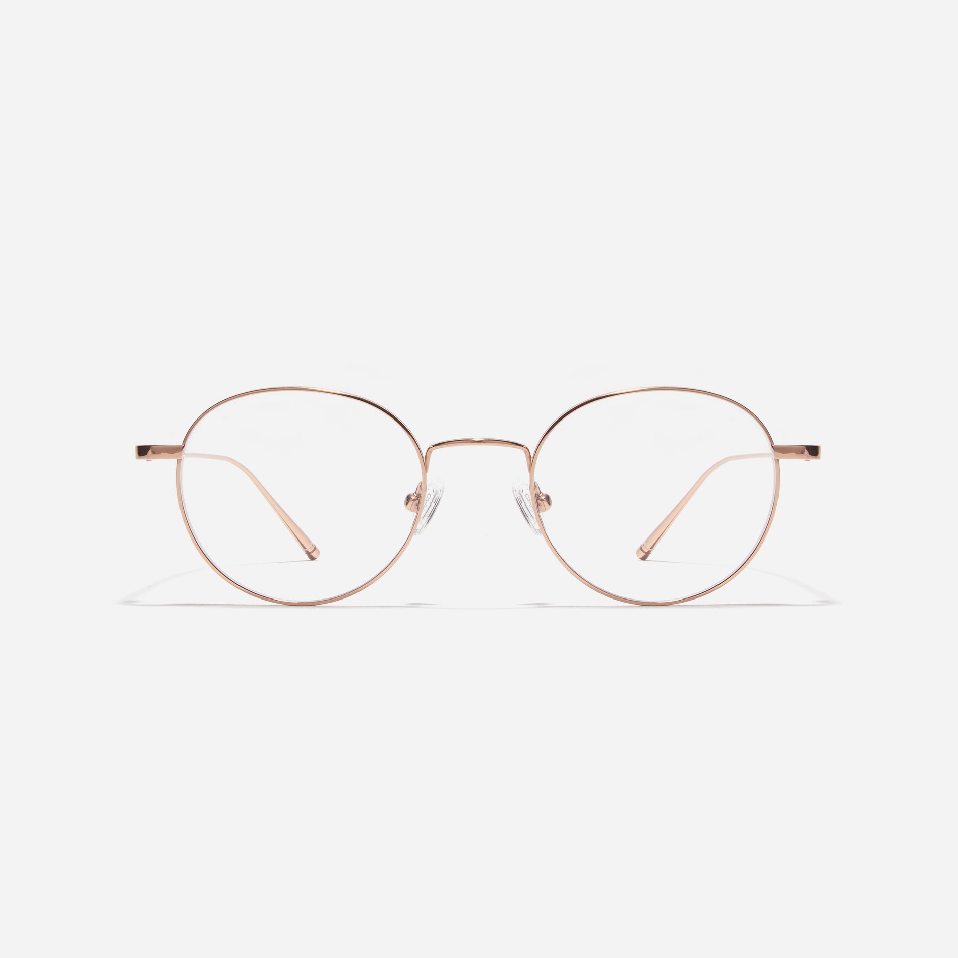 Round-shaped titanium eyeglasses inspired by the aesthetics of platform shoes. Their dual-rim structure effortlessly accommodates the use of thick lenses for higher prescriptions, while retro vibes shine through side color accents applied using epoxy techniques.