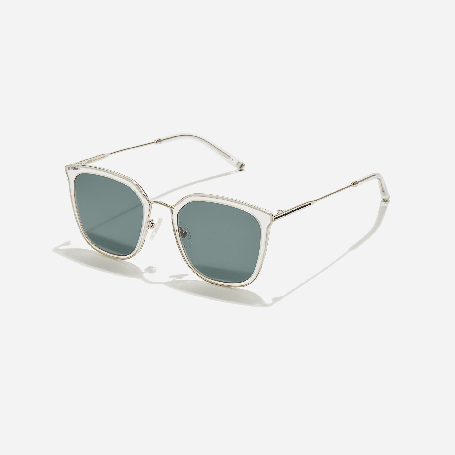 Combination sunglasses featuring flat lenses that ensure 100% UV protection, and unique nose bridge details.