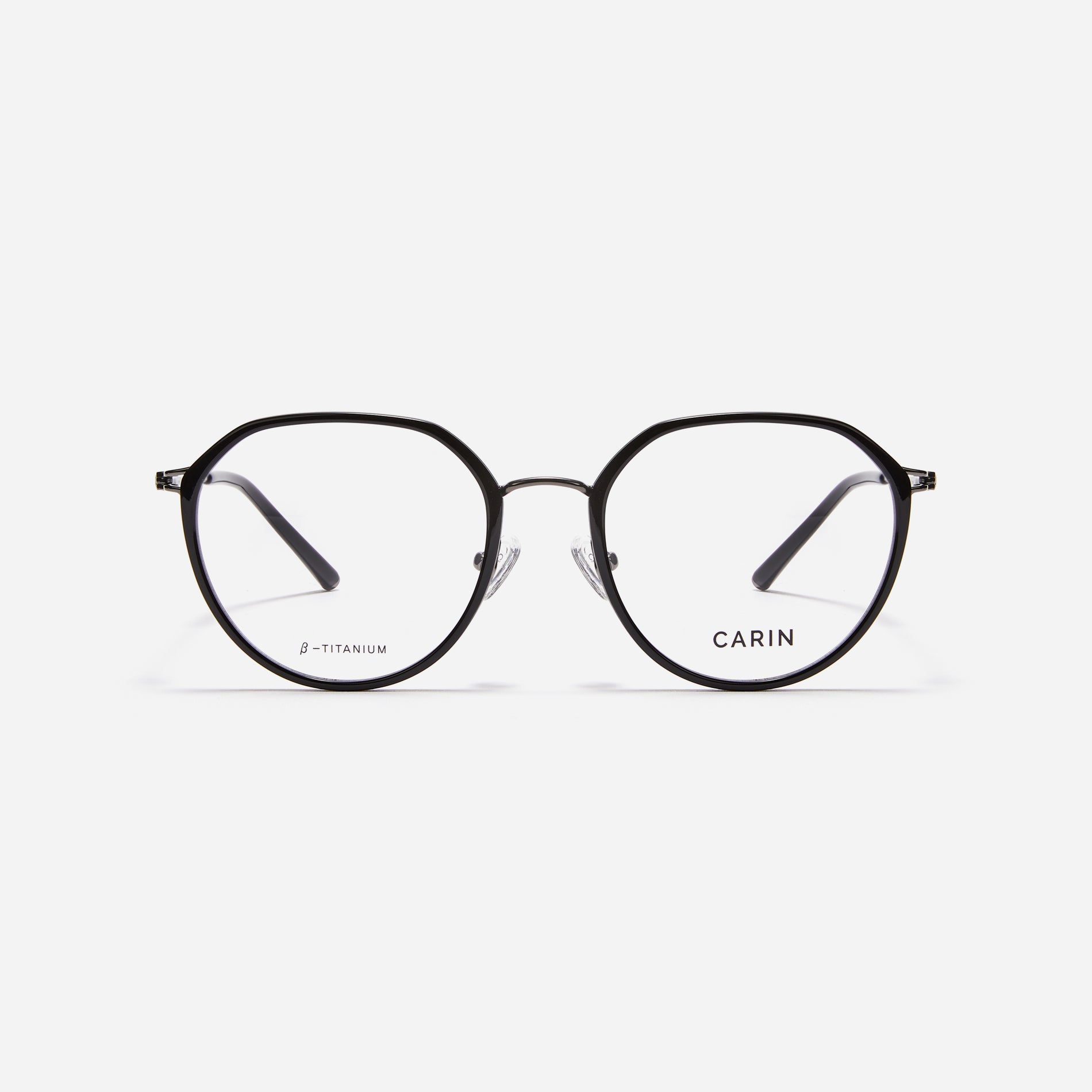 Combination eyeglasses featuring a harmonious blend of a polygonal lens shape and an acetate frame. These eyeglasses are characterized by a delicate acetate rim that secures the frame and hinge details. The slim temples, made from lightweight and elastic B-Titanium material, ensure a consistently comfortable fit.