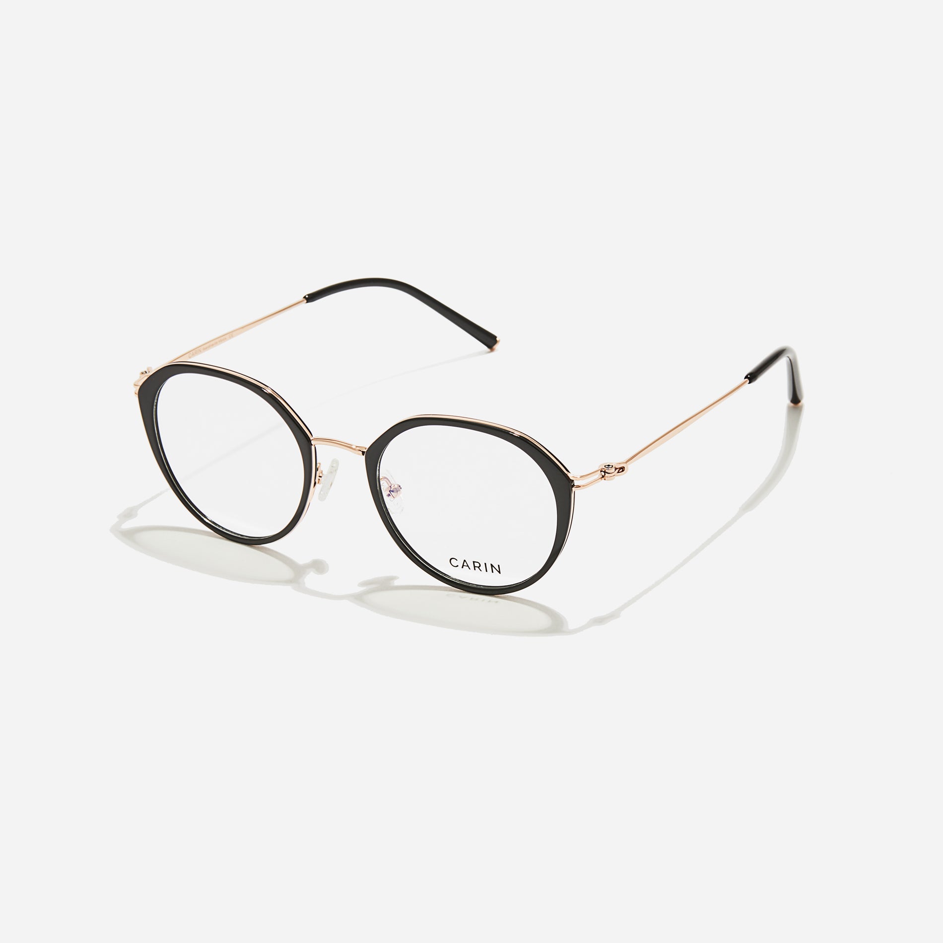 Polygonal-shaped eyeglasses that feature a contrasting round lens design, offering a smooth yet refined style. They provide a comfortable wearing experience with slim temples made from lightweight and elastic B-Titanium material.