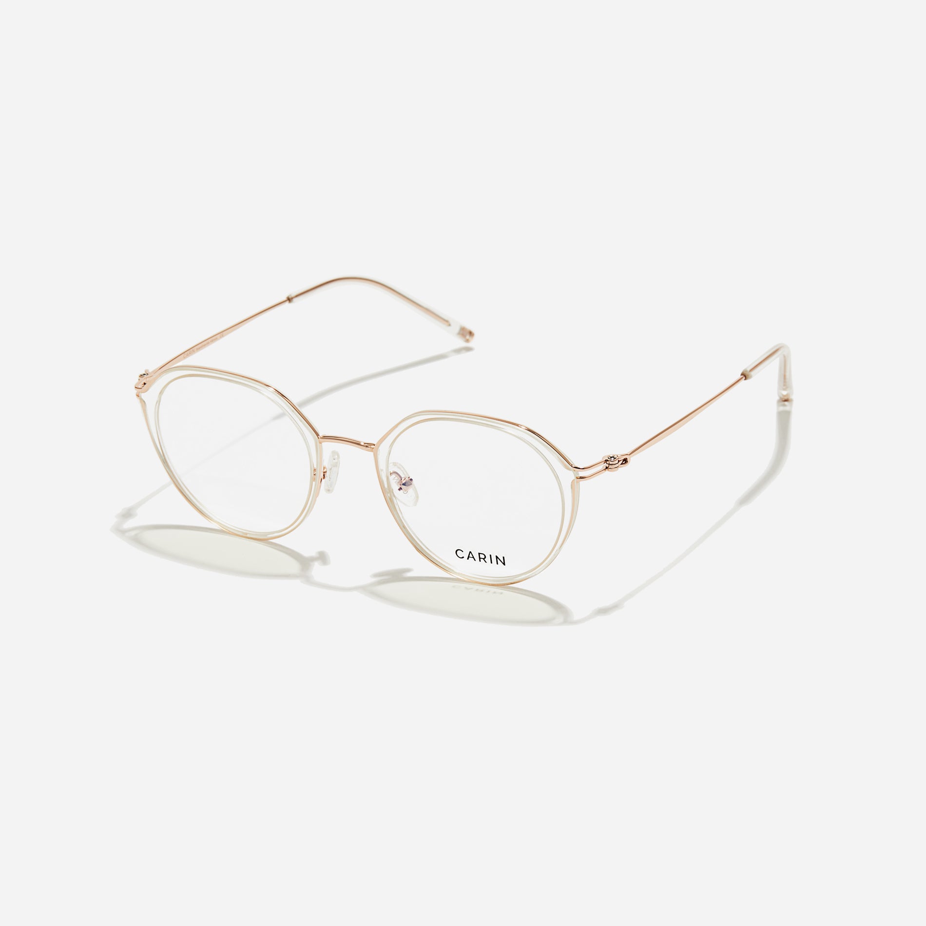 Polygonal-shaped eyeglasses that feature a contrasting round lens design, offering a smooth yet refined style. They provide a comfortable wearing experience with slim temples made from lightweight and elastic B-Titanium material.