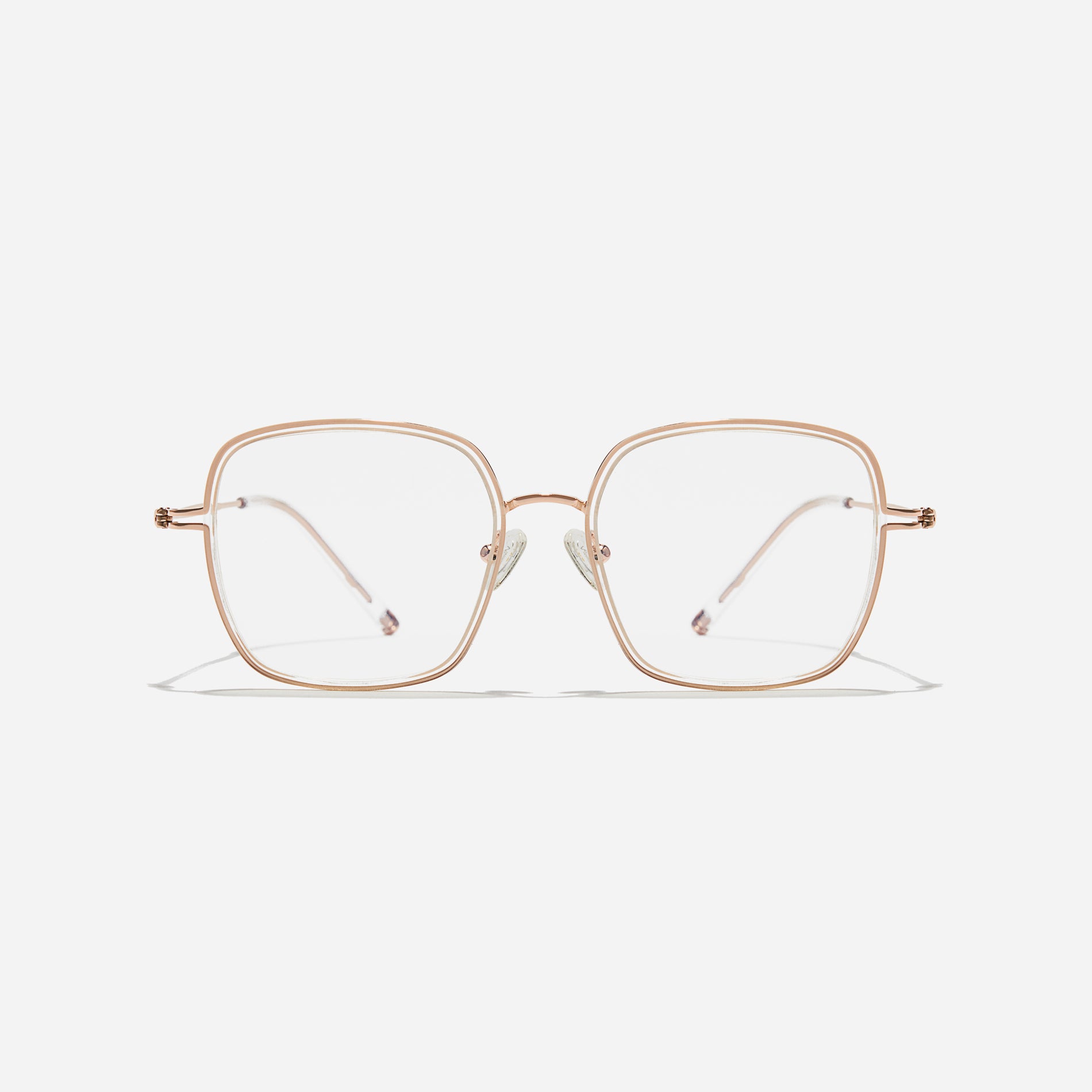 Rectangular-shaped oversized eyeglasses characterized by a delicate acetate rim that secures the frame and hinge details. The slim temples, made from lightweight and elastic B-Titanium material, ensure a consistently comfortable fit.