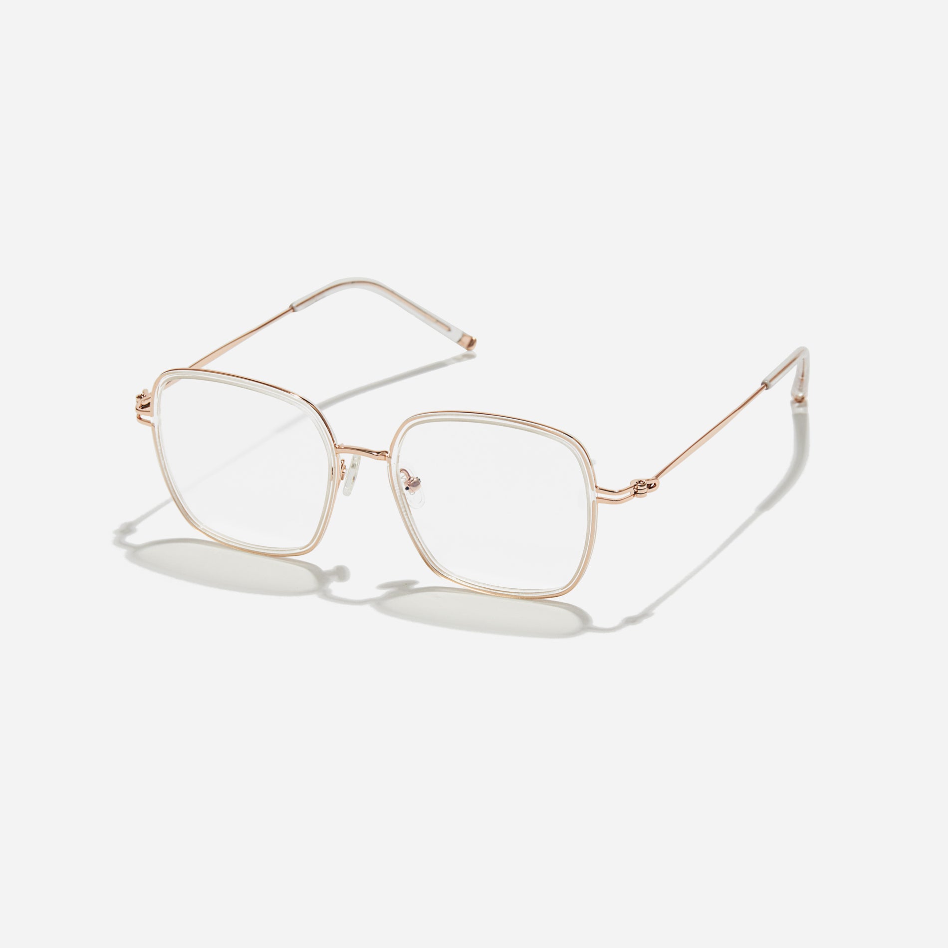 Rectangular-shaped oversized eyeglasses characterized by a delicate acetate rim that secures the frame and hinge details. The slim temples, made from lightweight and elastic B-Titanium material, ensure a consistently comfortable fit.