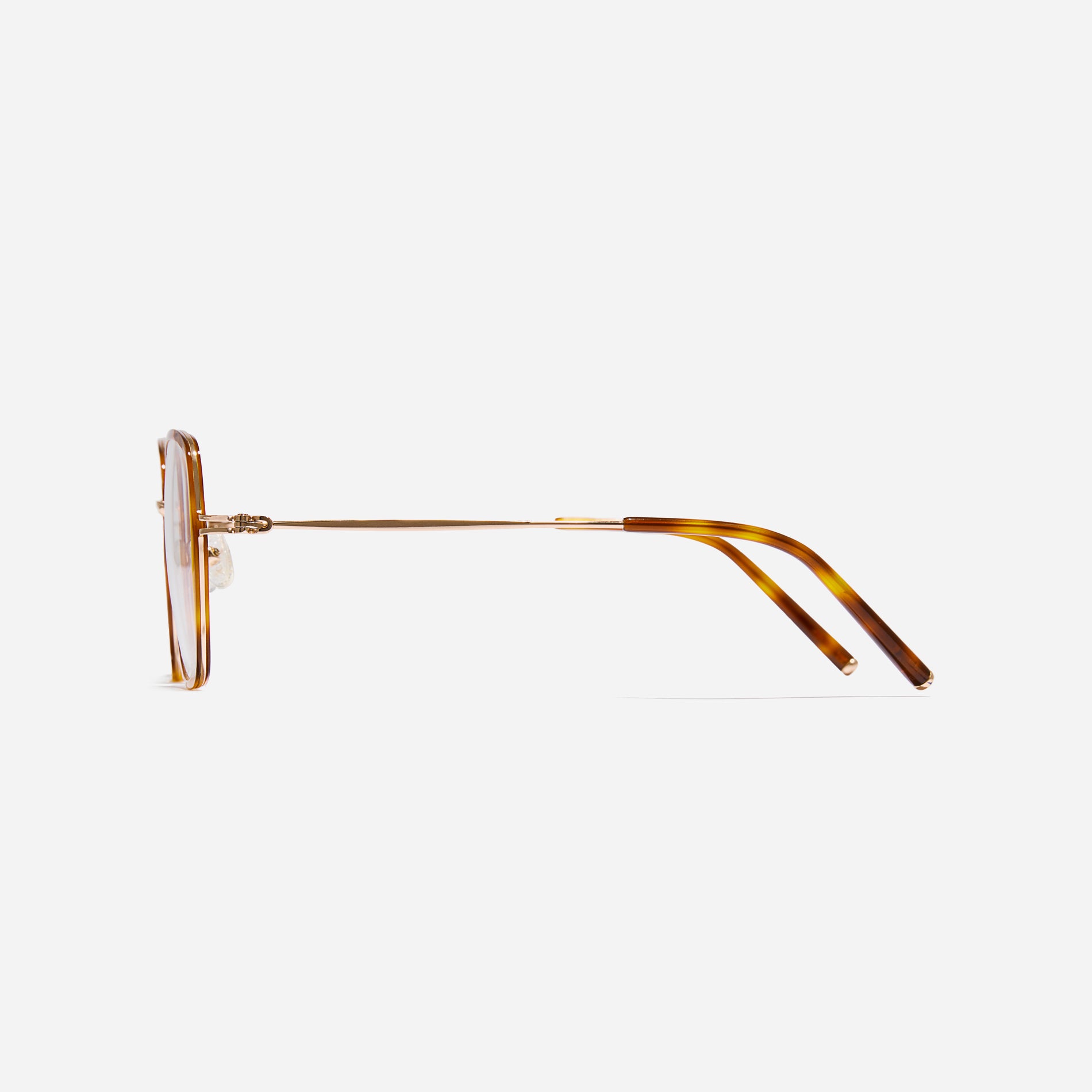 Rectangular-shaped oversized eyeglasses characterized by a delicate acetate rim that secures the frame and hinge details. The slim temples, made from lightweight and elastic B-Titanium material, ensure a consistently comfortable fit.