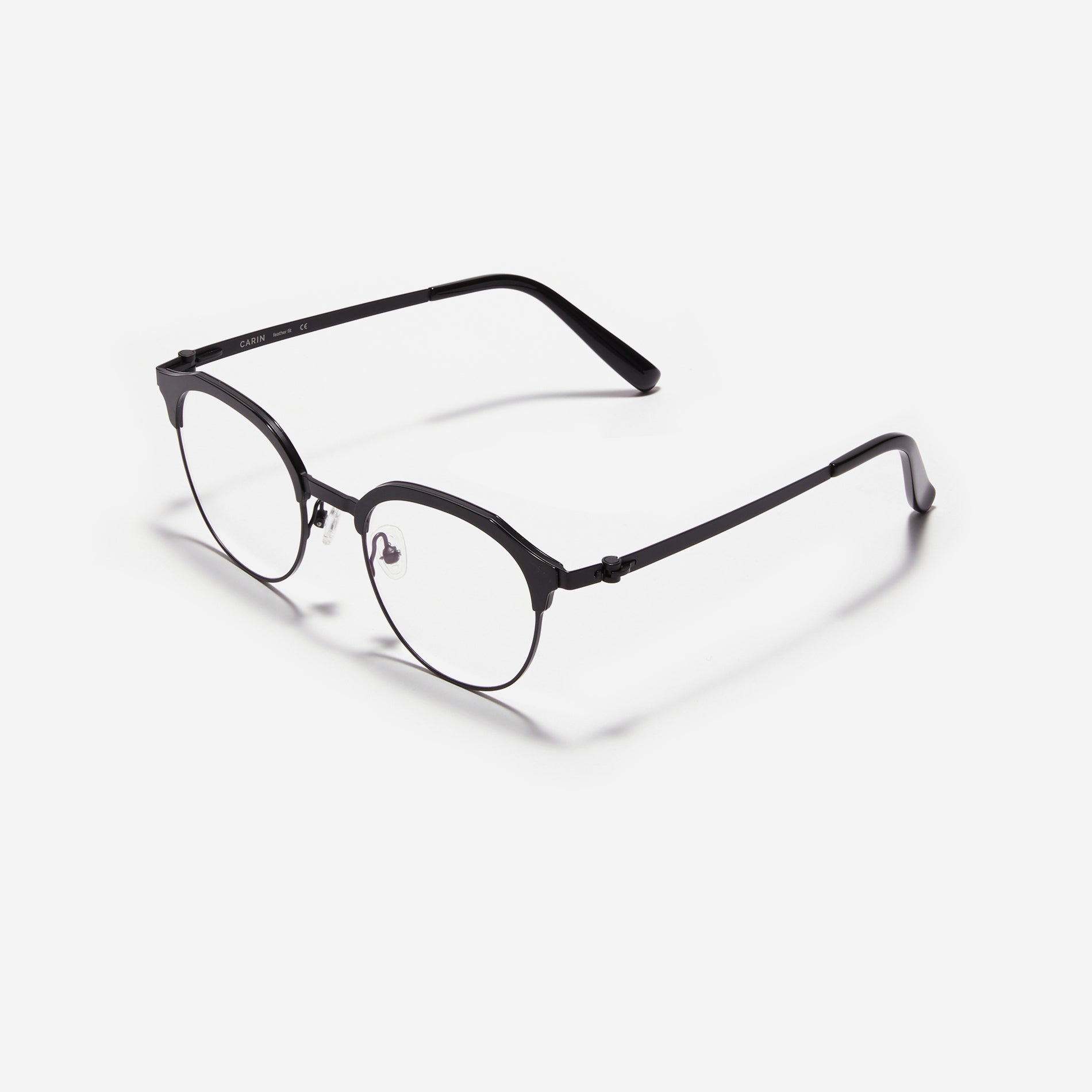 Lightweight polygon-shaped eyeglasses from CARIN's 'Feather Fit' line, offering a contemporary twist on the classic browline design.