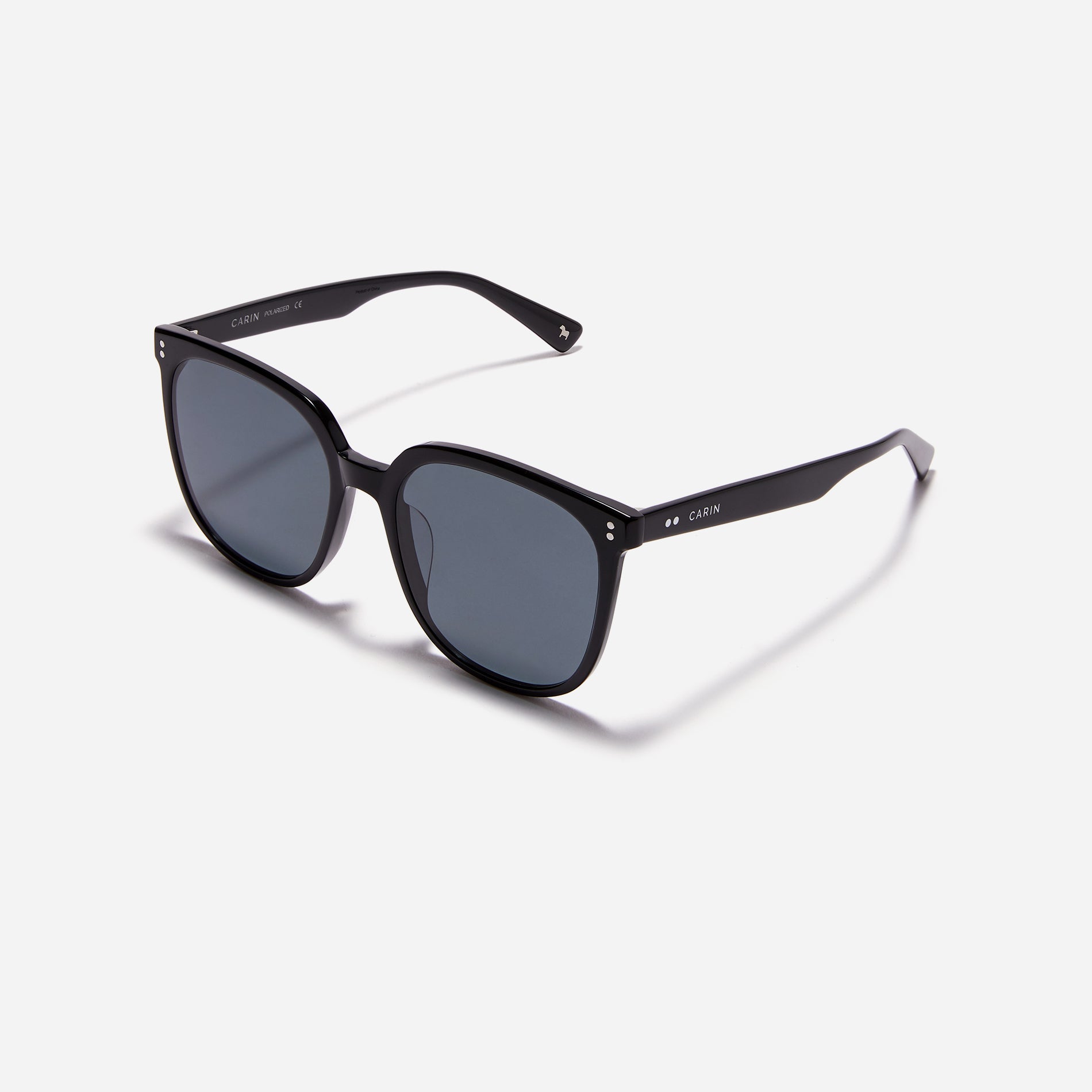 Square-shaped polarized sunglasses, crafted from compressed acetate material for enhanced lightweight properties.