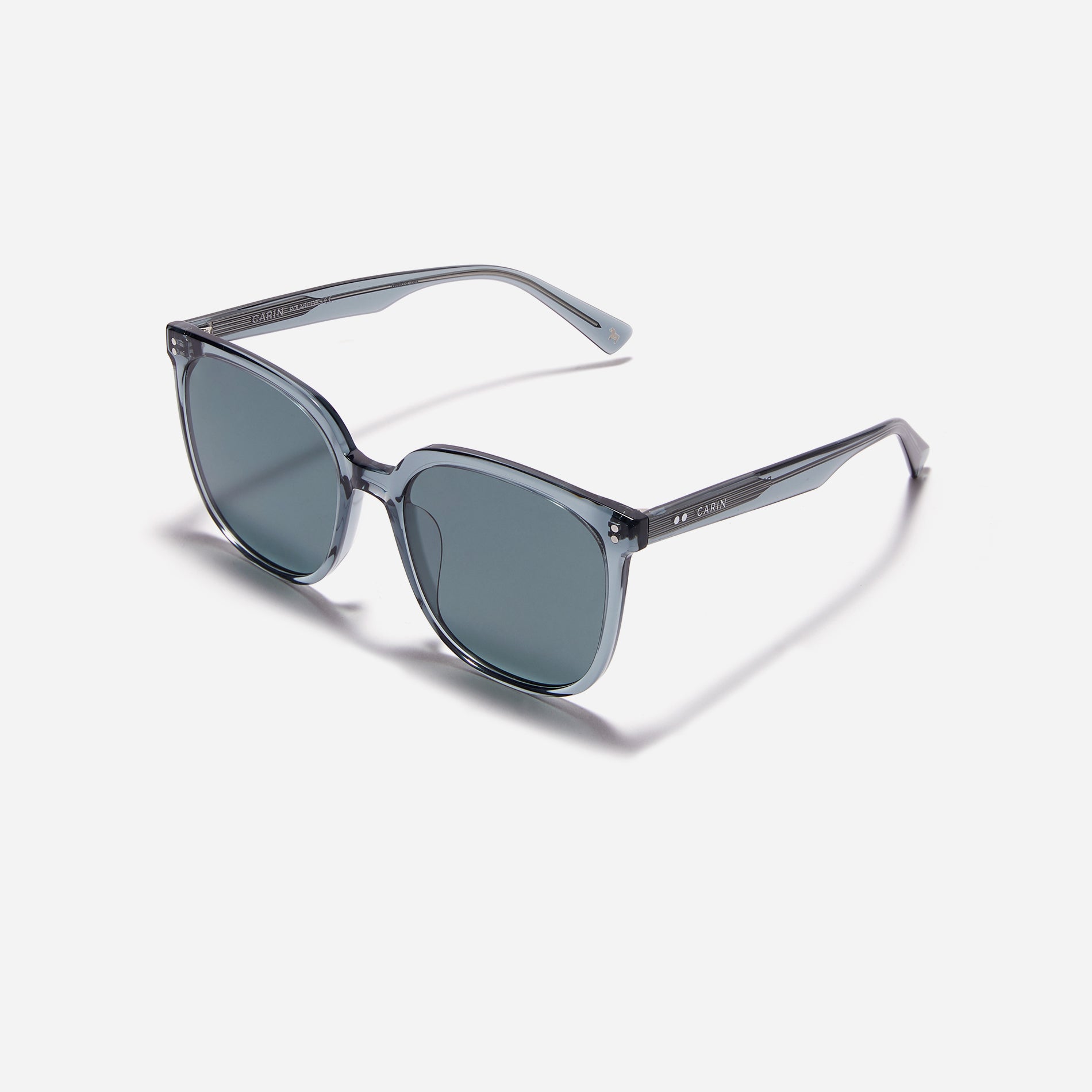 Square-shaped polarized sunglasses, crafted from compressed acetate material for enhanced lightweight properties.