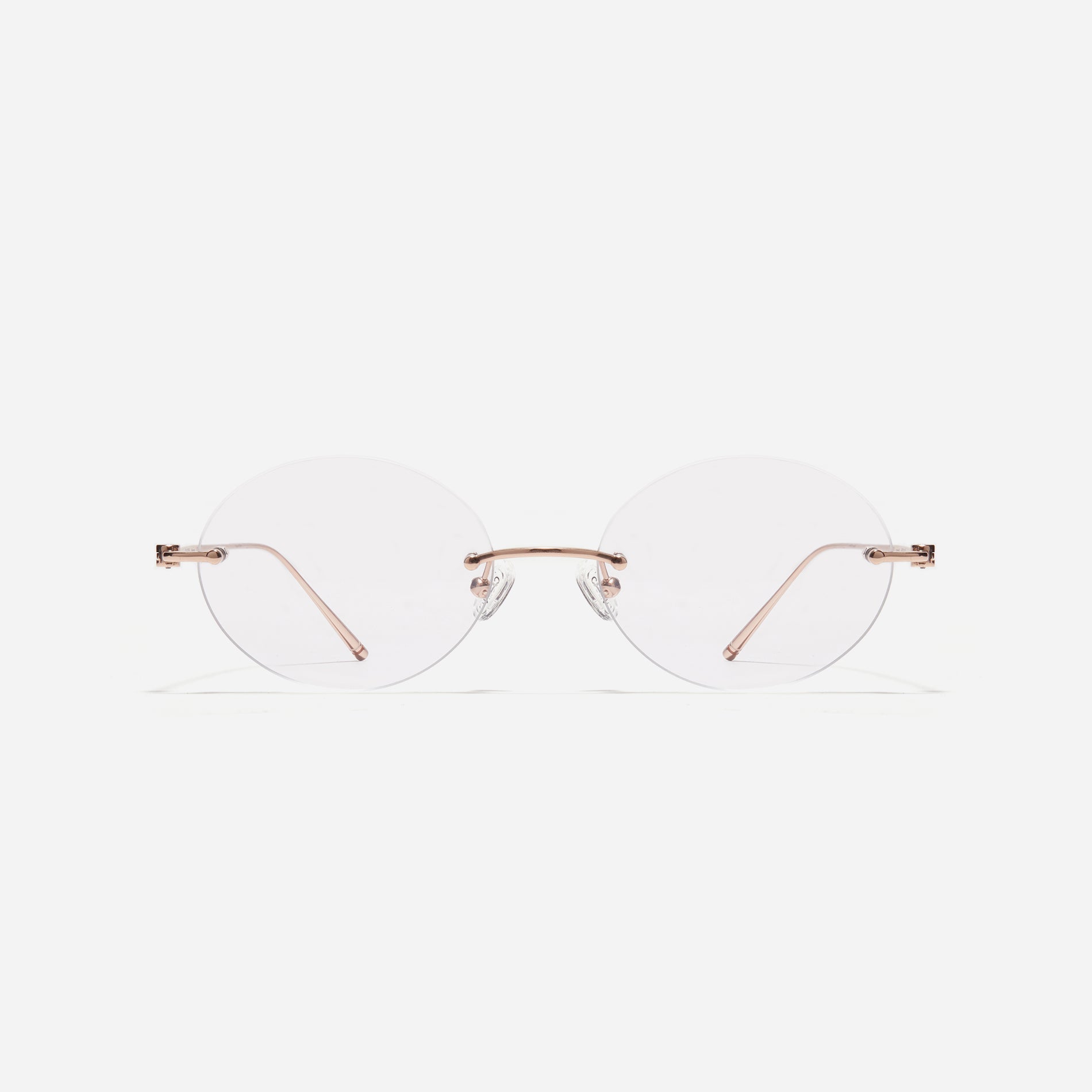 Rimless round-shaped retro eyeglasses. Featuring narrow rims and dual lining on the tips, these eyeglasses ensure a consistently comfortable fit and prevent slipping.