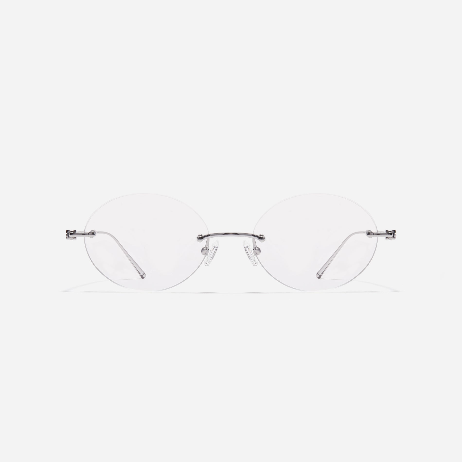  Rimless round-shaped retro eyeglasses. Featuring narrow rims and dual lining on the tips, these eyeglasses ensure a consistently comfortable fit and prevent slipping.