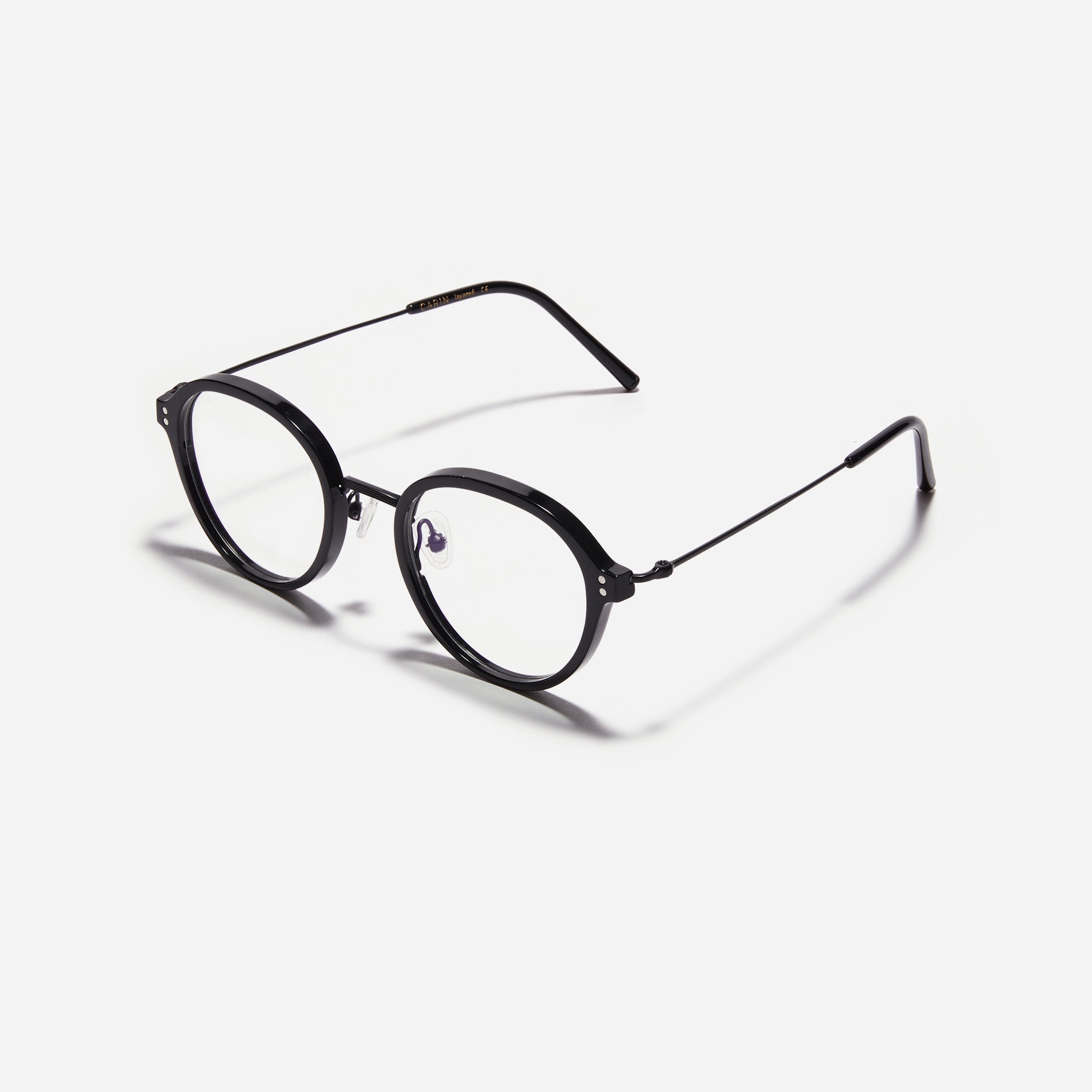 Round-shaped eyeglasses with a dual-combi structure inspired by from the aesthetics of platform shoes. Their dual-rim structure seamlessly accommodates thick lenses for higher prescriptions, while retro vibes are accentuated by side color accents.