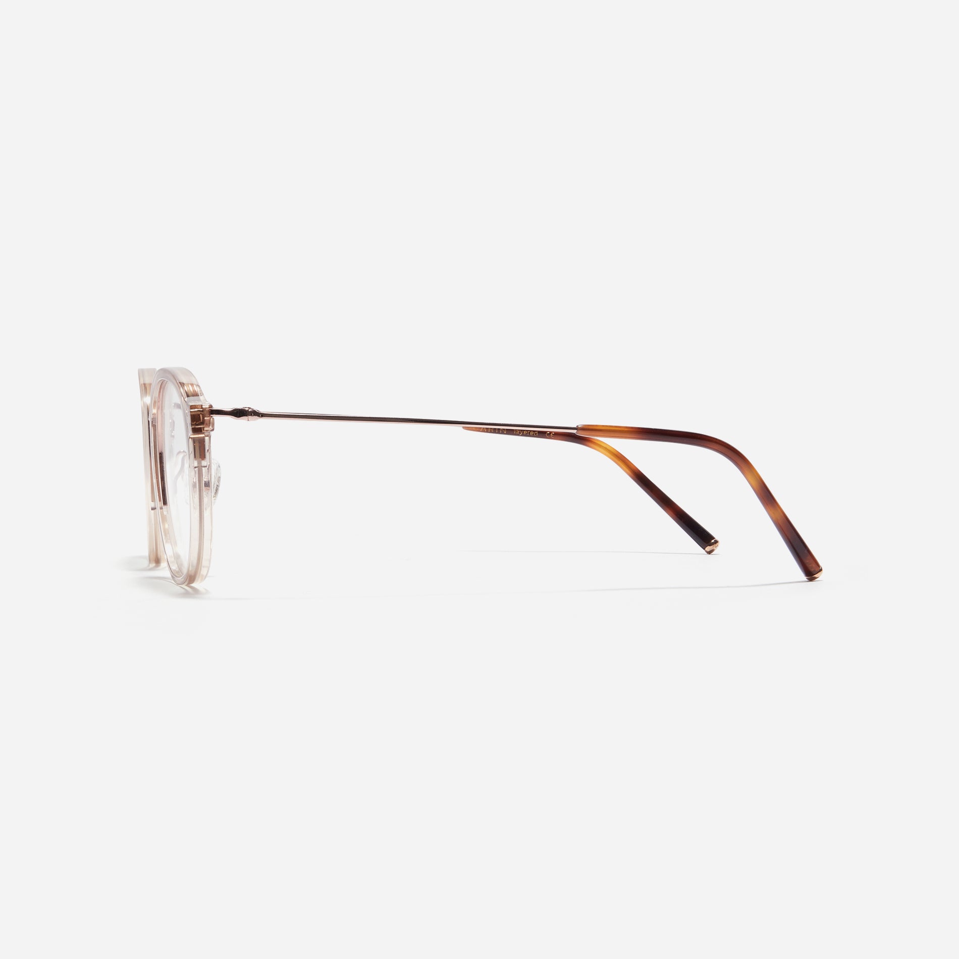 Square-shaped eyeglasses with a dual-combi structure inspired by from the aesthetics of platform shoes. Their dual-rim structure seamlessly accommodates thick lenses for higher prescriptions, while retro vibes are accentuated by side color accents applied using epoxy techniques.