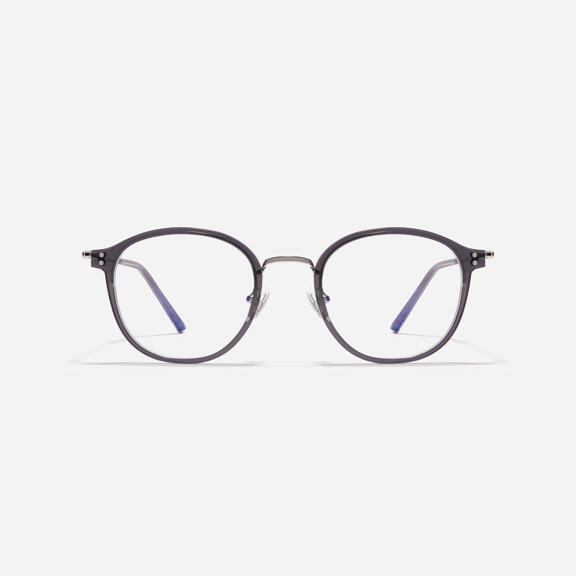 Square-shaped eyeglasses with a dual-combi structure inspired by from the aesthetics of platform shoes. Their dual-rim structure seamlessly accommodates thick lenses for higher prescriptions, while retro vibes are accentuated by side color accents applied using epoxy techniques.