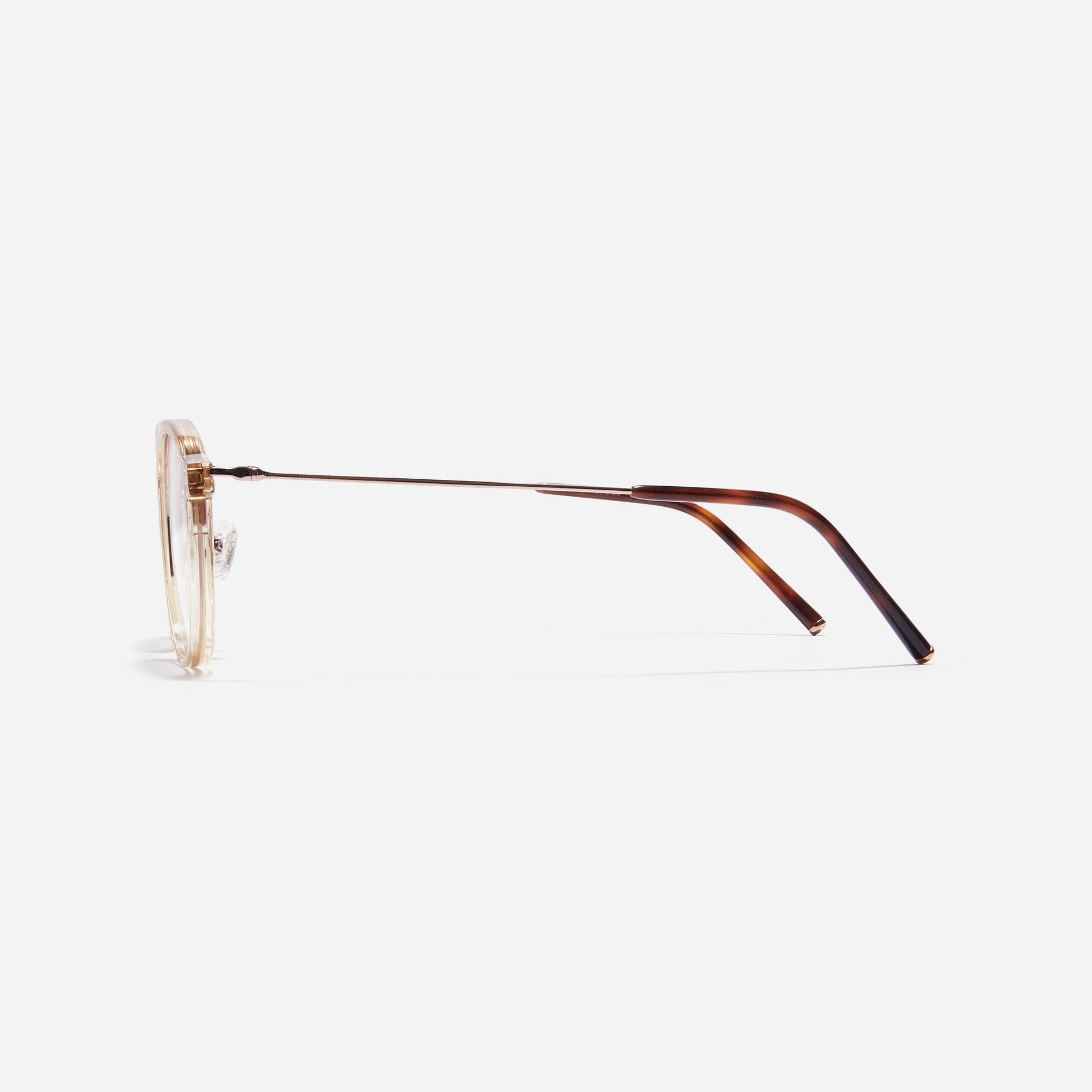 Square-shaped eyeglasses with a dual-combi structure inspired by from the aesthetics of platform shoes. Their dual-rim structure seamlessly accommodates thick lenses for higher prescriptions, while retro vibes are accentuated by side color accents applied using epoxy techniques.
