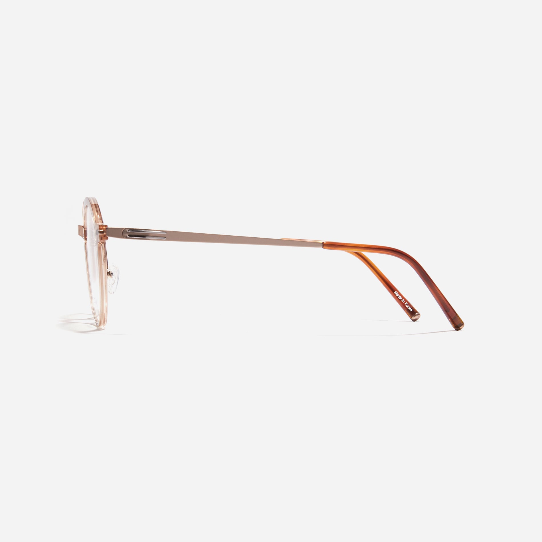 Round-shaped combination eyeglasses from CARIN's 'Feather Fit' line. Their combination frame seamlessly blends bio-plastic and titanium, utilizing advanced injection molding technology, often seen in the manufacturing of cell phones and watches.