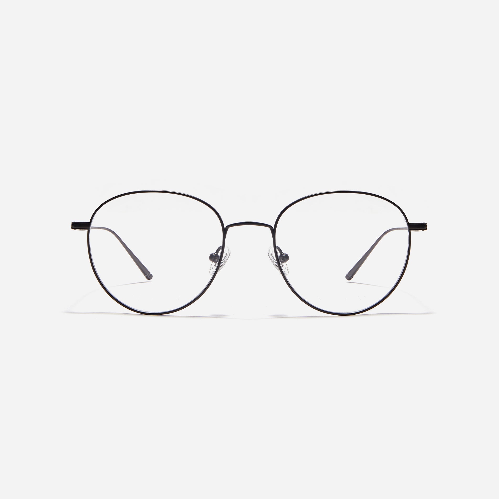 Boston-style round-shaped eyeglasses that naturally enhance one's facial features. Crafted entirely from titanium, they guarantee a lighter and more comfortable fit, while modern design makes them a perfect choice for those seeking a contemporary look.