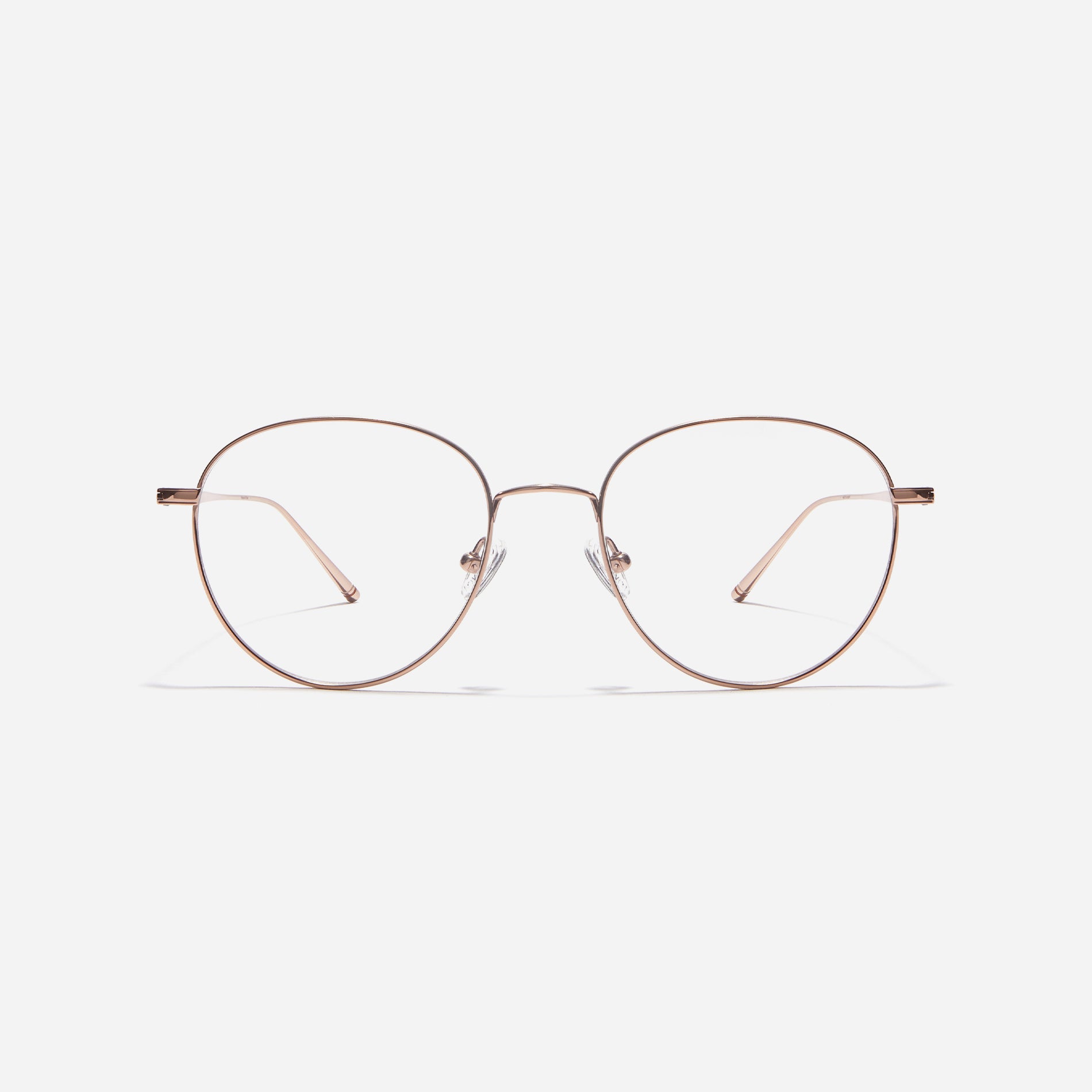 Boston-style round-shaped eyeglasses that naturally enhance one's facial features. Crafted entirely from titanium, they guarantee a lighter and more comfortable fit, while modern design makes them a perfect choice for those seeking a contemporary look.