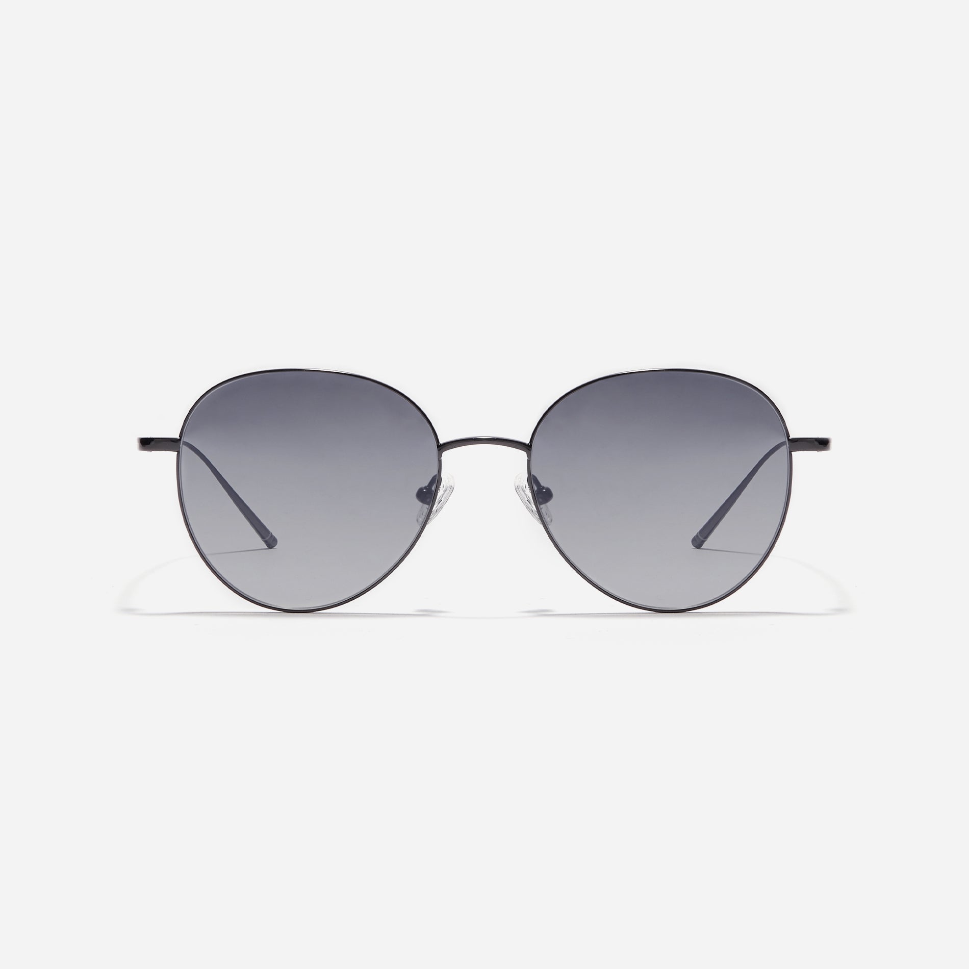 Round-shaped sunglasses crafted entirely from lightweight titanium. They feature semi-mirrored lenses that effectively reflect light, minimizing eye fatigue.
