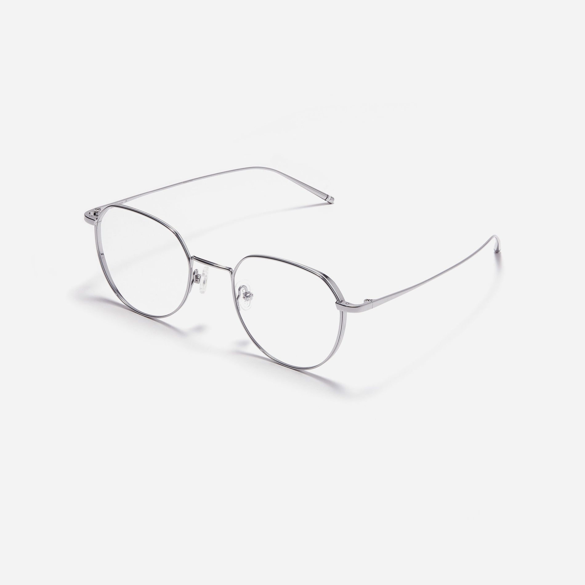 Polygonal-shaped, full-metal eyeglasses with a dual-rim structure designed to accommodate thicker, high-prescription lenses. Both the frame and temples are made of pure titanium, ensuring a lightweight and comfortable fit.
