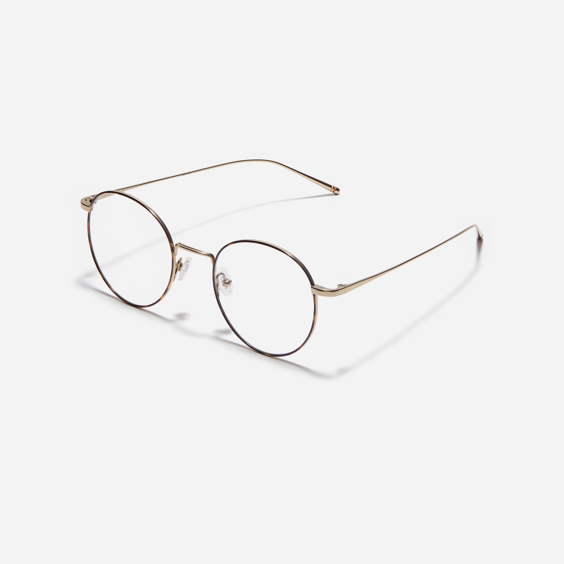 Round-shaped eyeglasses that naturally complement all face shapes. Crafted entirely from titanium, the frame provides exceptional durability and featherweight comfort, while its design adds a touch of casual charm to one's daily style.